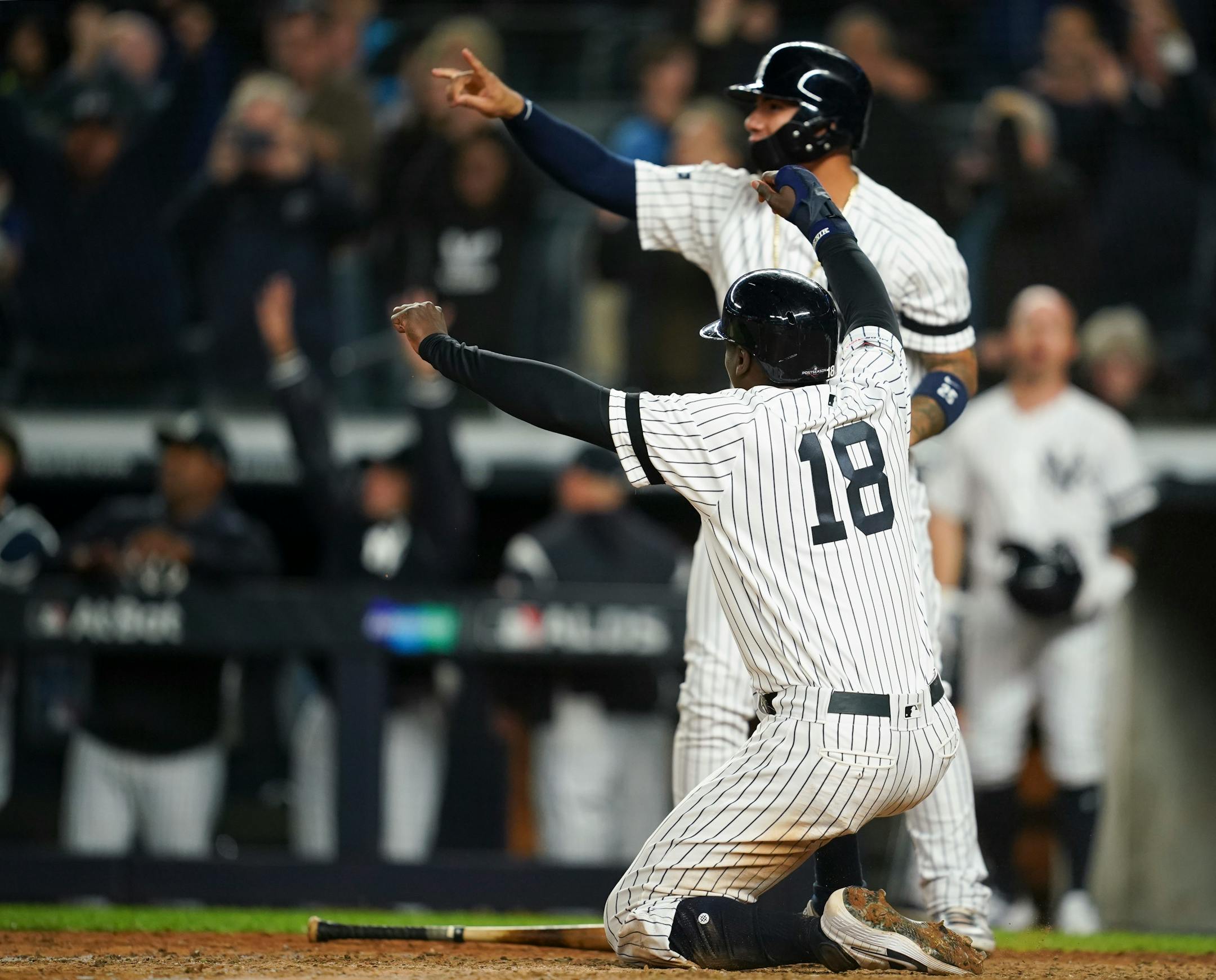 Didi Gregorius and Gleyber Torres celebrated after they scored, along with Cameron Maybin
