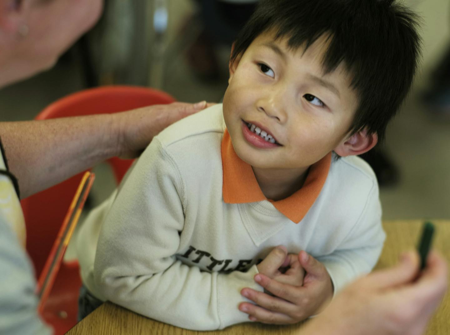 At the Sandburg Learning Center in Golden Valley, Tiger Vongsoury,4, looked up to educational assistant Jane Wicklund for some guidance on how to color a leaf.] The 40th anniversay of ECFE in the north west metro is coming up.Richard Tsong-Taatarii/rtsong- taatarii@startribune.com