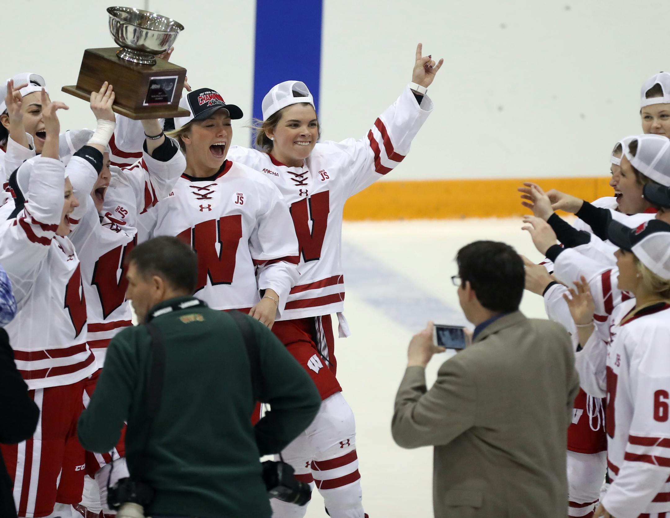 Wisconsin celebrated its 4-1 victory over UMD in the WCHA women's tournament final Sunday at Ridder Arena. The Gophers, however, still qualified for the NCAA tournament.