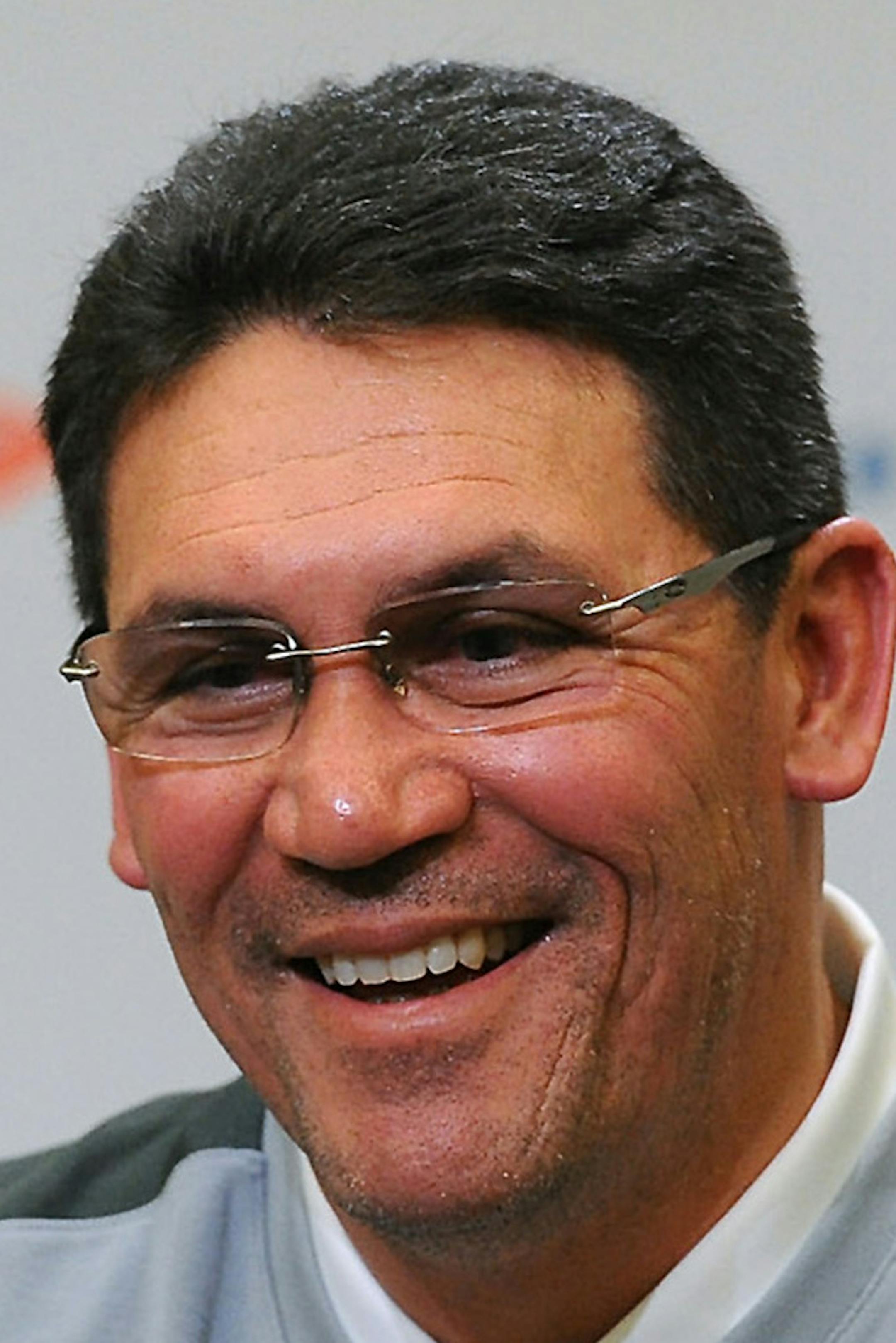 Carolina Panthers head coach Ron Rivera was able to muster a smile while responding to questions during his press conference on Monday, Jan. 5, 2015 at Bank of America Stadium in Charlotte, N.C. Charlotte firefighters battled a two-alarm fire at Rivera's home early Monday morning. All the occupants of the home were able to get out safely with no injuries reported. The family's pets were also rescued. (Jeff Siner/Charlotte Observer/TNS)