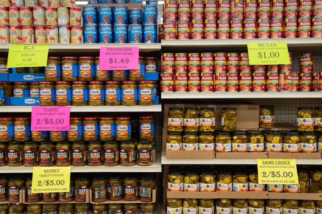 Prices are posted on shelves at Mike's Discount Foods in Fridley. The store sells items that are close to or past their best-by date, supermarket overstocks and more, all at steep discounts.

