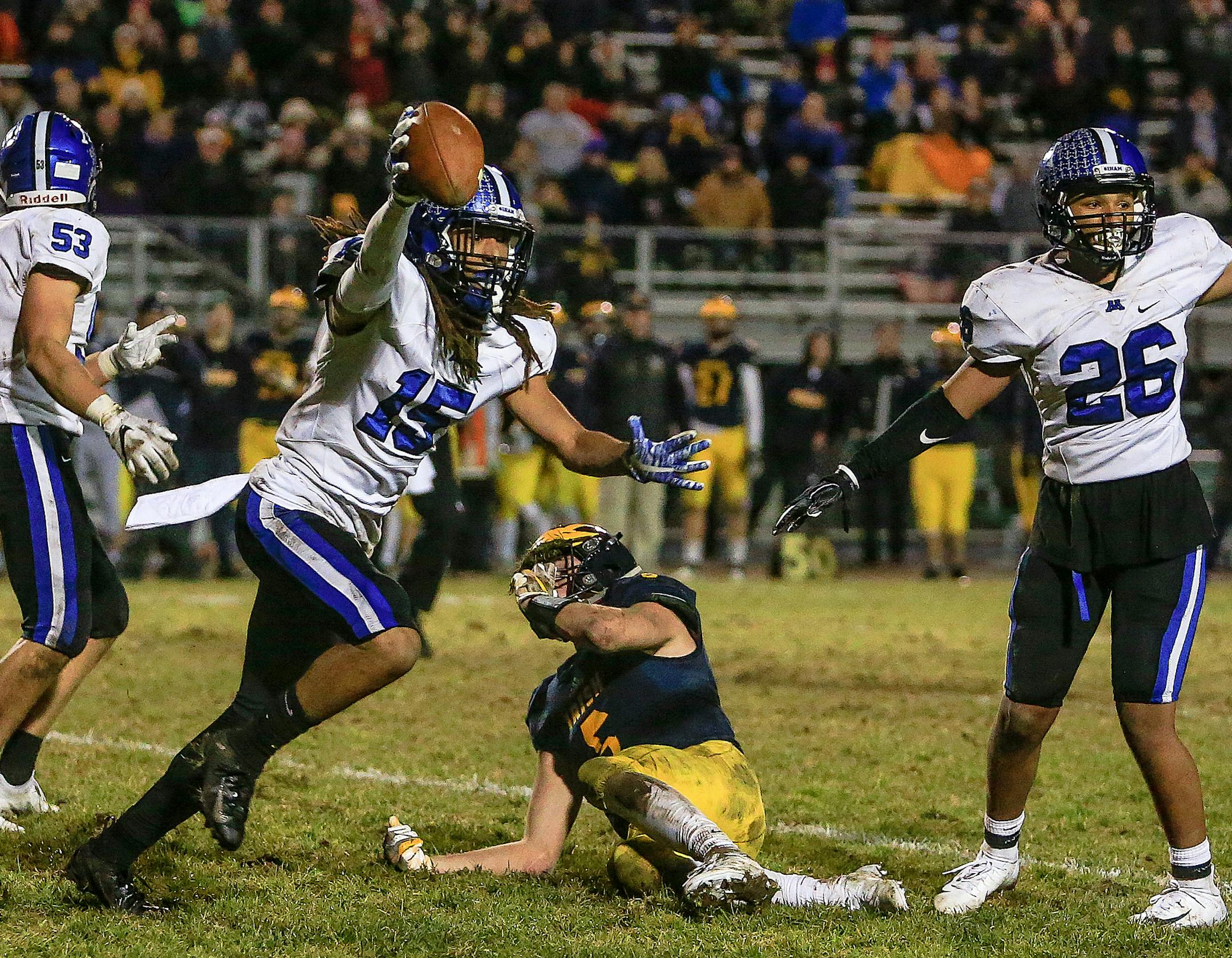 Minnetonka senior Raheem Brown (15) celebrated his second interception of the second half. It killed Rosemount's drive deep in Minnetonka territory with just seconds left to play and preserved the Skippers' 13-10 Class 6A playoff victory. Photo by Mark Hvidsten, SportsEngine