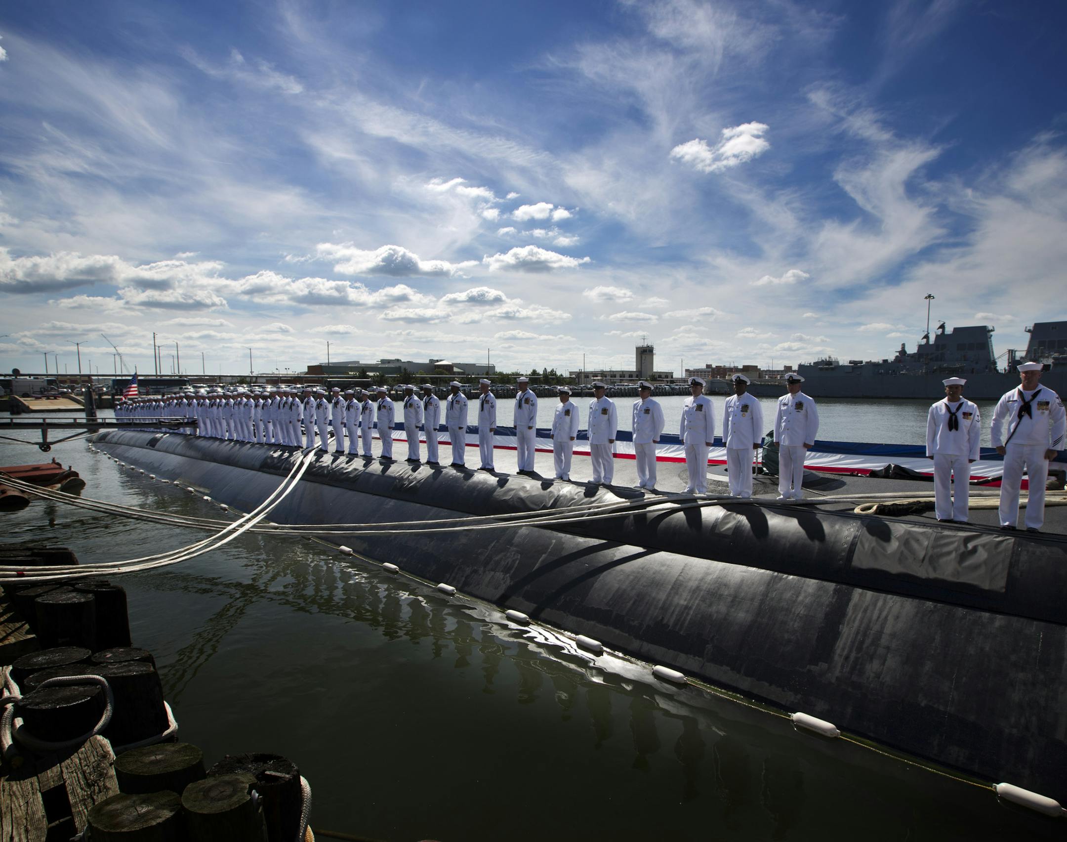 Sailors stand guard on the USS Minnesota prior to commissioning ceremonies for the Virginia class submarine, Saturday, Sept. 7, 2013 at Naval Station Norfolk in Norfolk, Va.