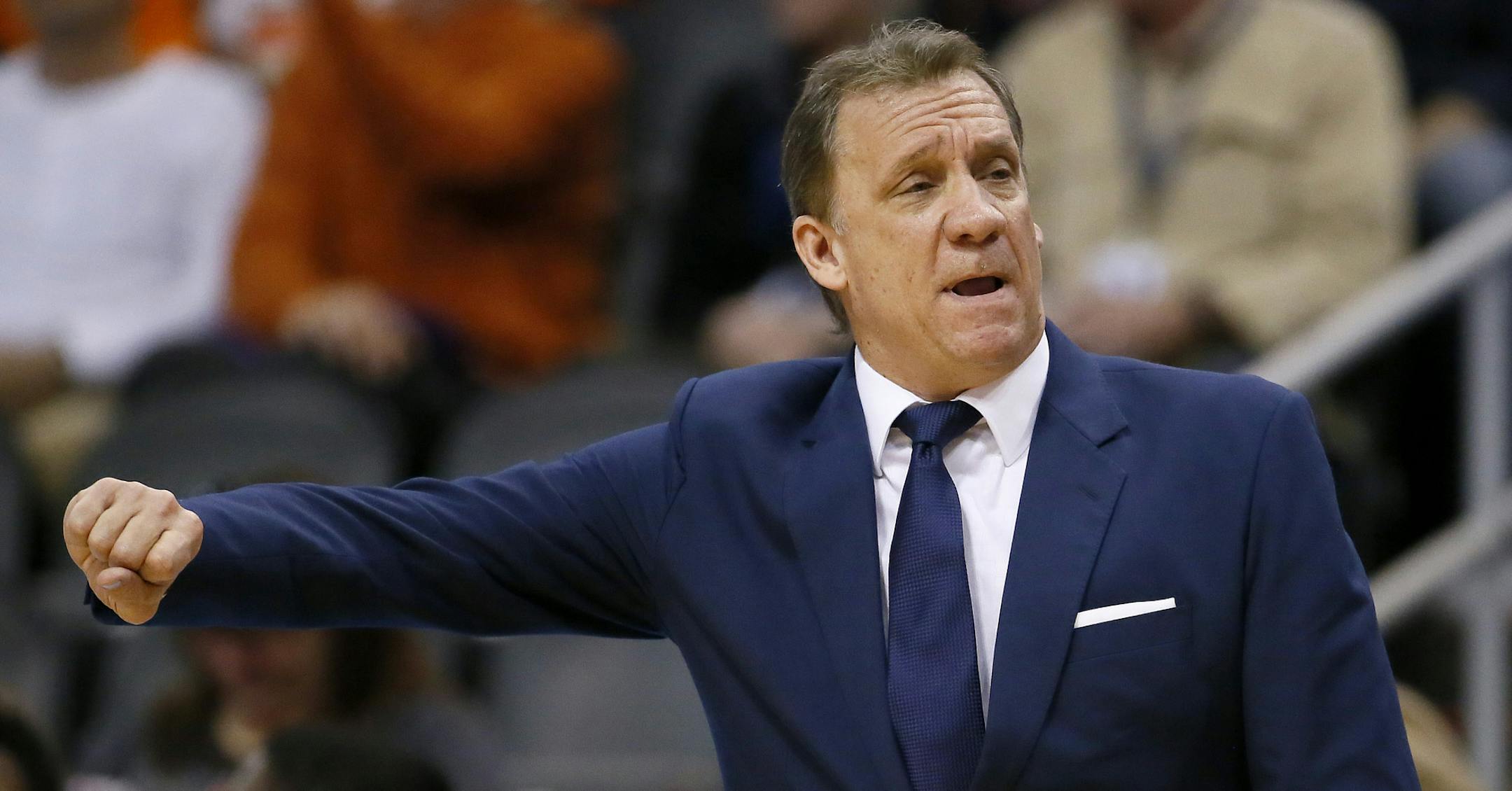 Minnesota Timberwolves head coach Flip Saunders motions to his team during the first half of an NBA basketball game against the Phoenix Suns, Friday, Jan. 16, 2015, in Phoenix. (AP Photo/Matt York)
