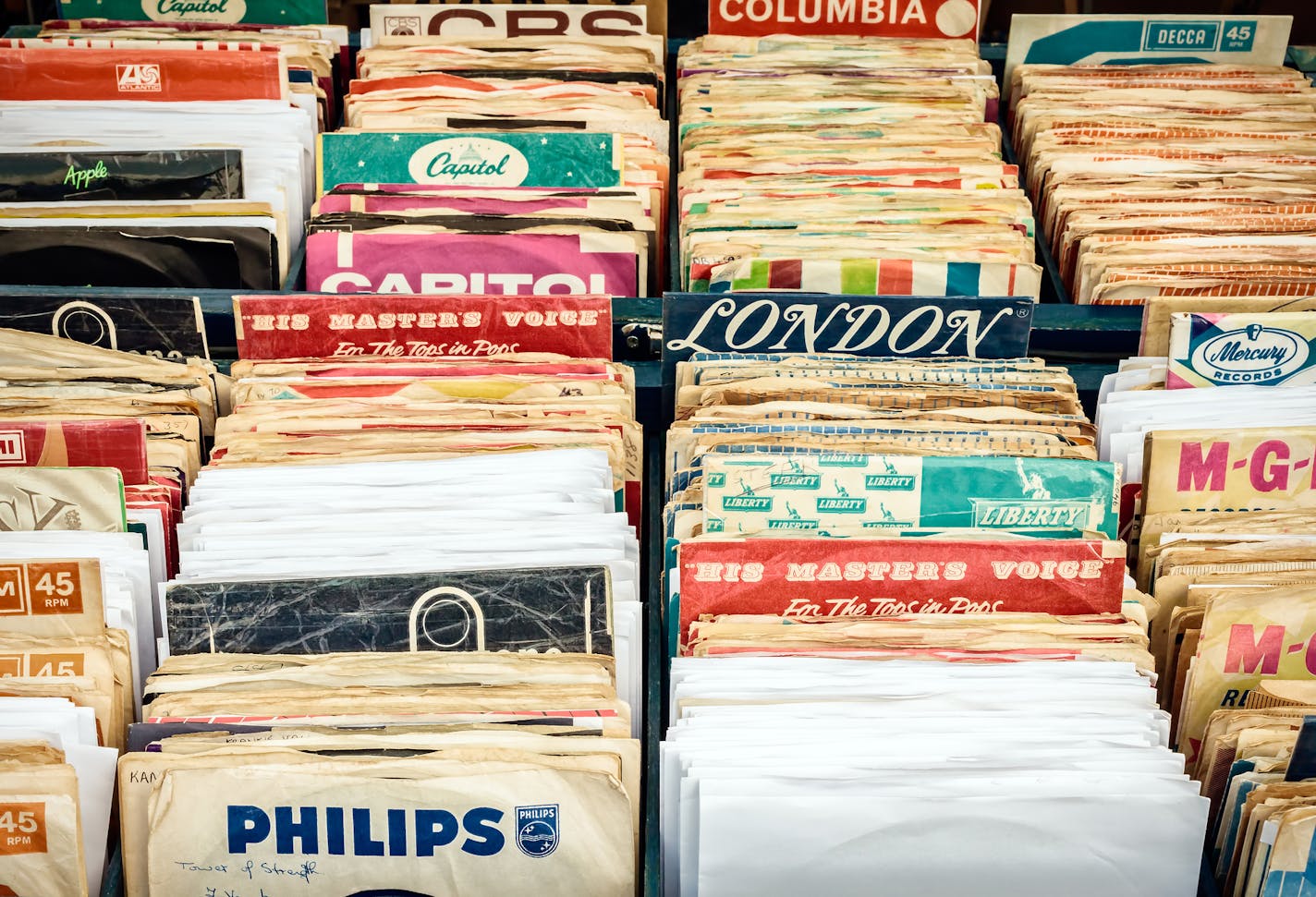 Rosmalen, The Netherlands - May 10, 2015: Wooden boxes with vinyl turntable records on a flea market in Rosmalen, The Netherlands