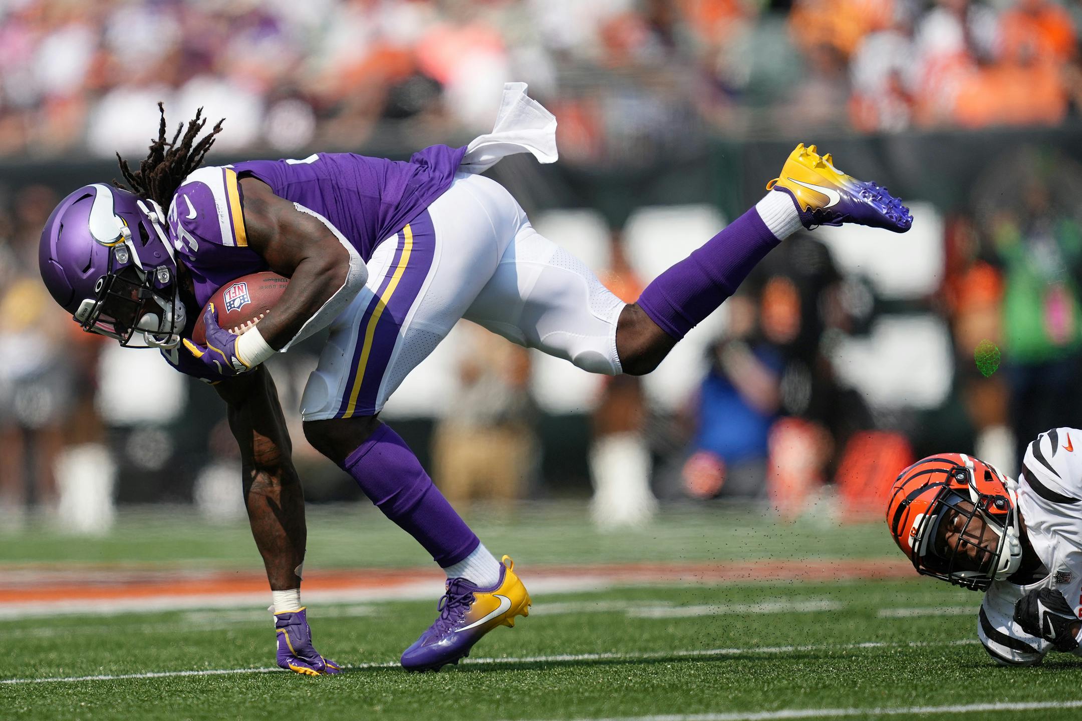 Minnesota Vikings running back Dalvin Cook (33) got tripped up as he rushed the ball in the third quarter.