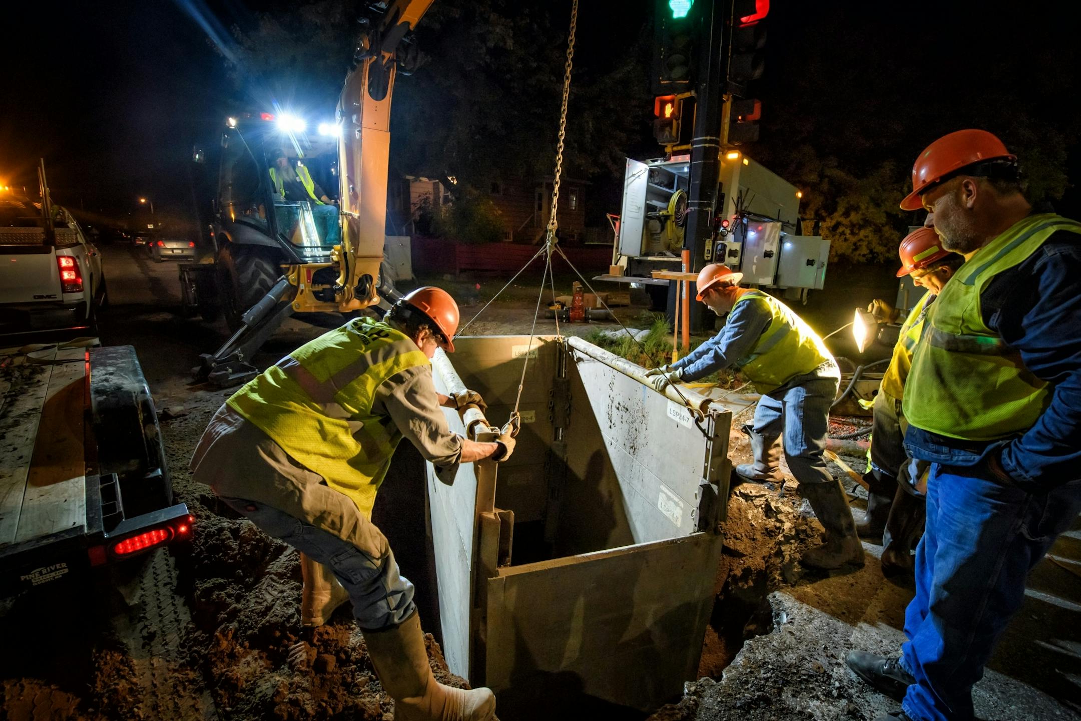 Workers from Duluth Public Works and Utilities Department replace a broken water main valve at Grand Avenue and 40th Ave West. Work was done overnight to avoid disrupting traffic during the day.