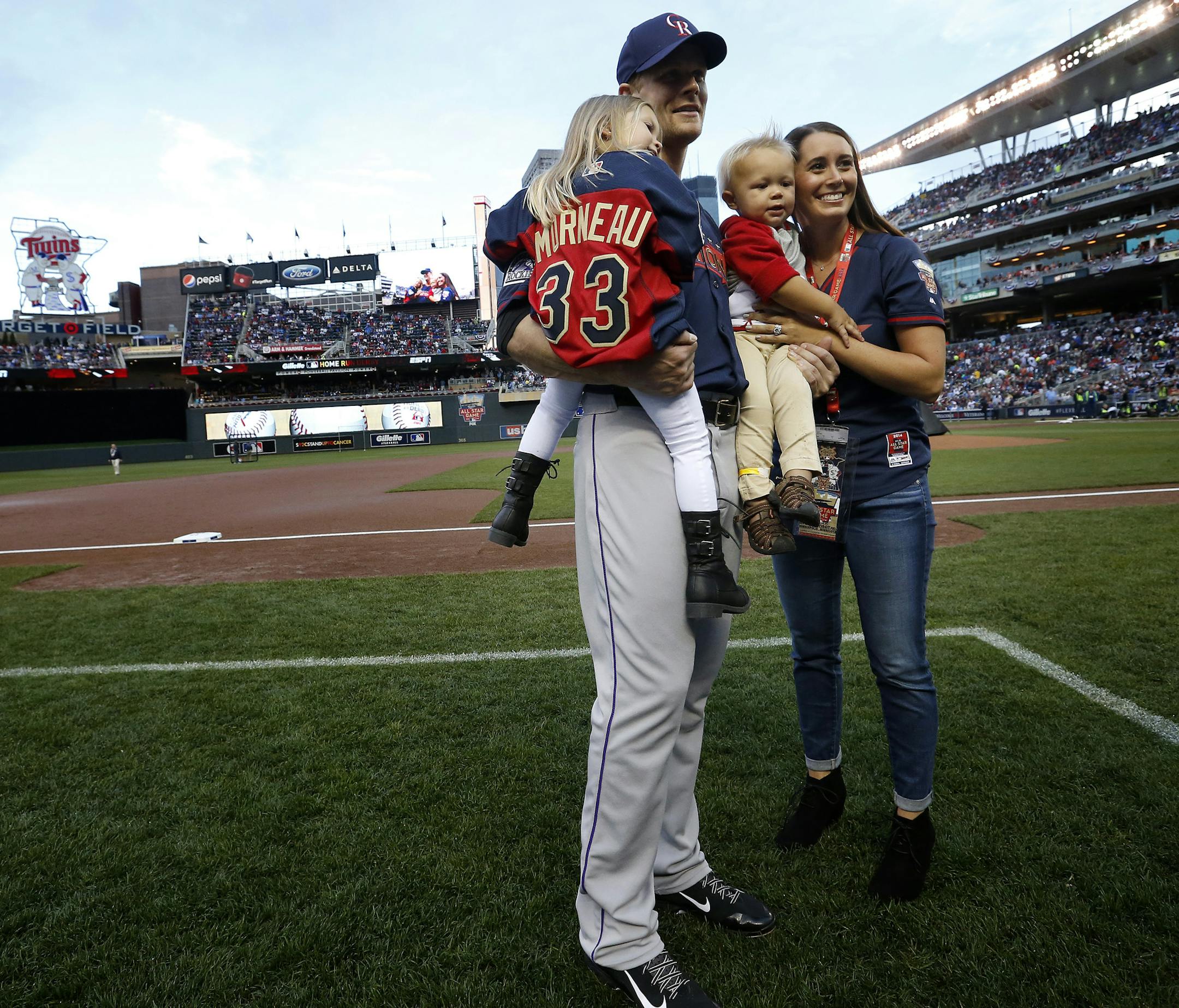 Justin Moreau posed for pictures with his family before the Home Run Derby on Monday at Target Field. ] CARLOS GONZALEZ cgonzalez@startribune.com - July 14, 2014 , Minneapolis, Minn., Target Field, All Star Home Run Derby