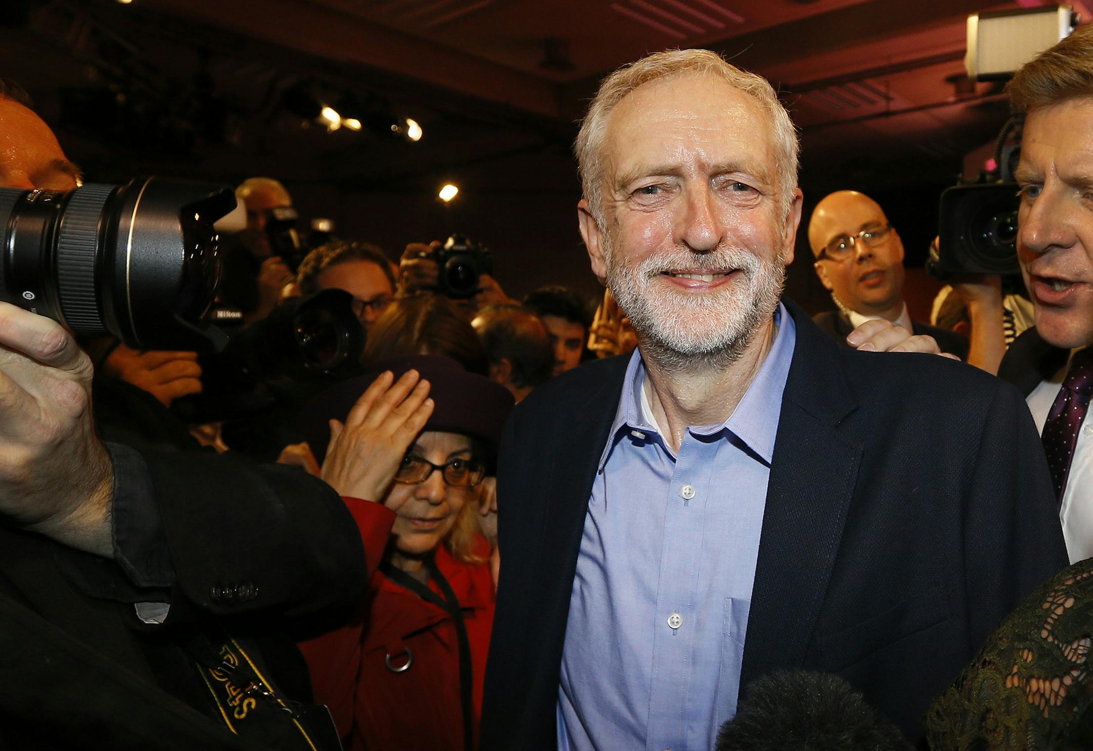 Jeremy Corbyn smiles as he leaves the stage after he is announced as the new leader of The Labour Party during the Labour Party Leadership Conference in London, Saturday, Sept. 12, 2015. Corbyn will now lead Britain's main opposition party. (AP Photo/Kirsty Wigglesworth) ORG XMIT: MIN2015091812513960