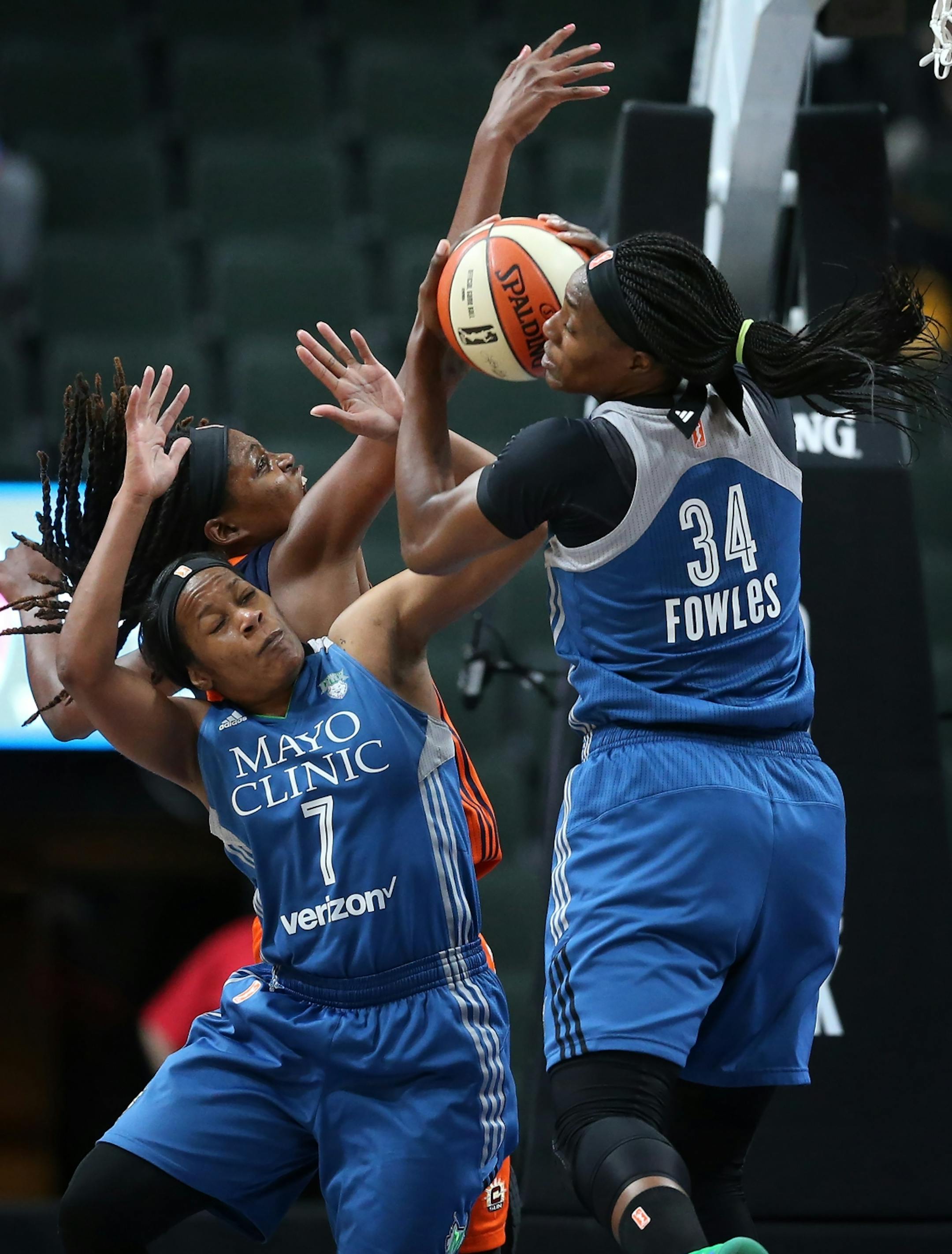 Minnesota Lynx center Sylvia Fowles (34) pulled down a defensive rebound as teammate Jia Perkins (7), boxed Connecticut Sun forward Jonquel Jones (35) out in the second half at Xcel Energy Center May 22, 2017 in St. Paul, MN.