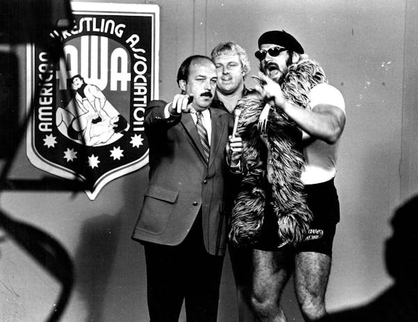 Gene Okerlund jousted with pro wrestler Jesse "the Body" Ventura, right, and Ventura's manager, Bobby "the Brain" Heenan, in 1982 on an American Wrest