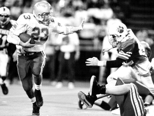 The ol’ stiff-arm was the strategy for Mike Nathan of Rocori against Spring Lake Park in the 1991 final.