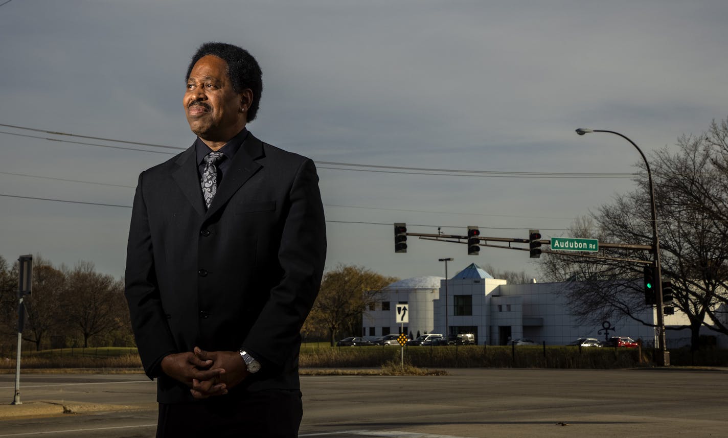 Mark Webster photographed at intersection of Highway 5 and Audubon Road in Chanhassen near Paisley Park. Webster and another man are on a quest to rename surrounding streets after Prince. ] CARLOS GONZALEZ ¥ cgonzalez@startribune.com Ð Chanhassen, MN, November 6, 2020, Two men, one of them a security guard at Paisley Park who says he was a friend of Prince's, are on a quest to rename surrounding streets after Prince. Chanhassen city staffers have looked into it and the City Council will discuss