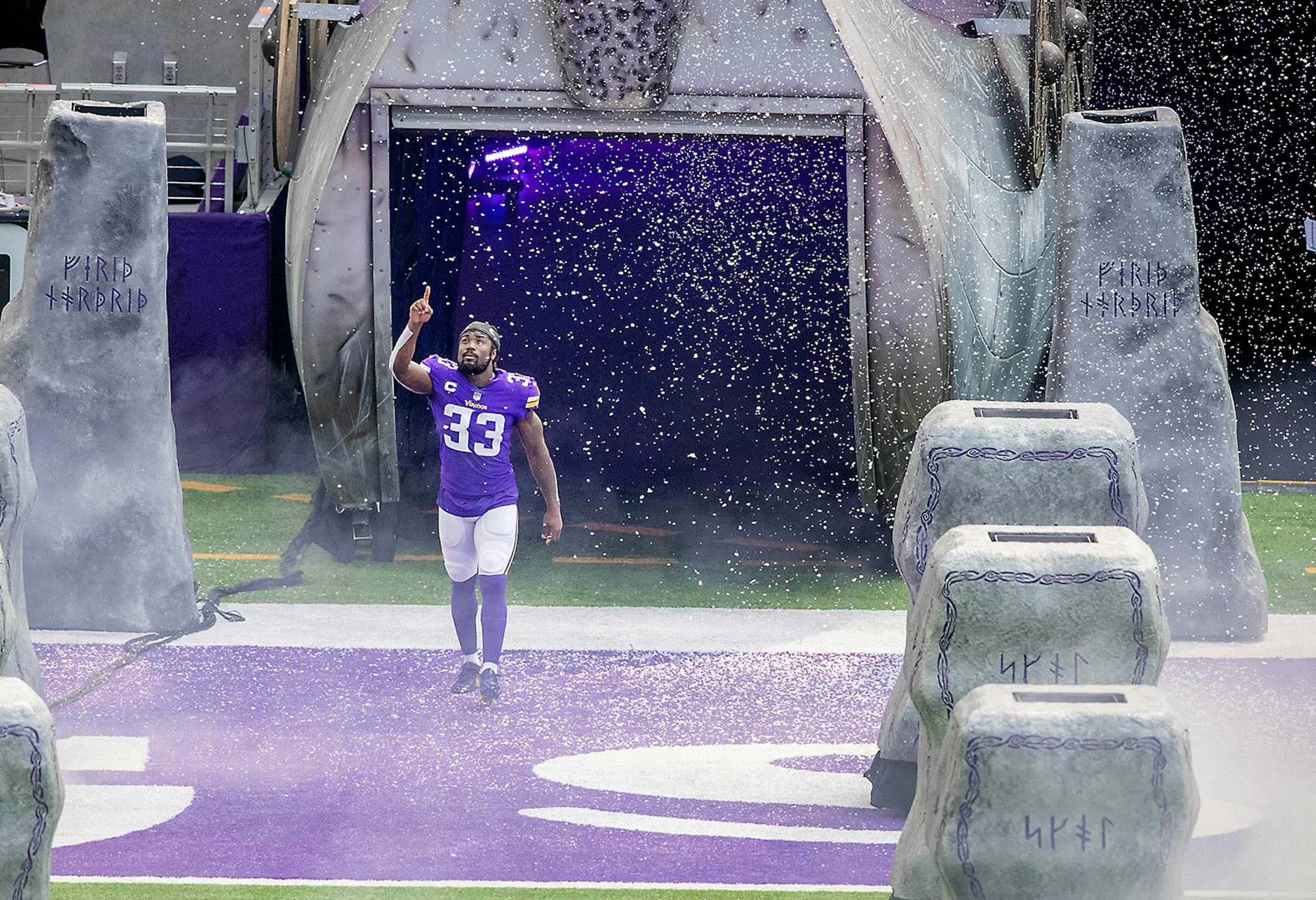 Minnesota Vikings running back Dalvin Cook ran out onto the field before the Vikings took on the Green Bay Packers.