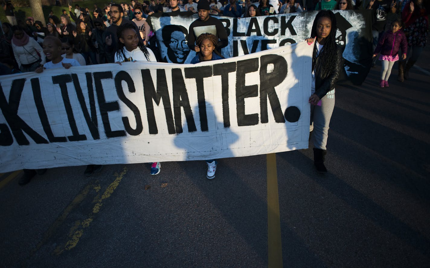 Protesters marched down Plymouth Ave. N to the Minneapolis 4th Precinct. ] Mark Vancleave - mark.vancleave@startribune.com * Neighbors and community members gathered at the scene where a man was shot and wounded by a Minneapolis Police officer early Sunday morning on the 1600 block of Plymouth Ave. N on Nov. 15, 2015.