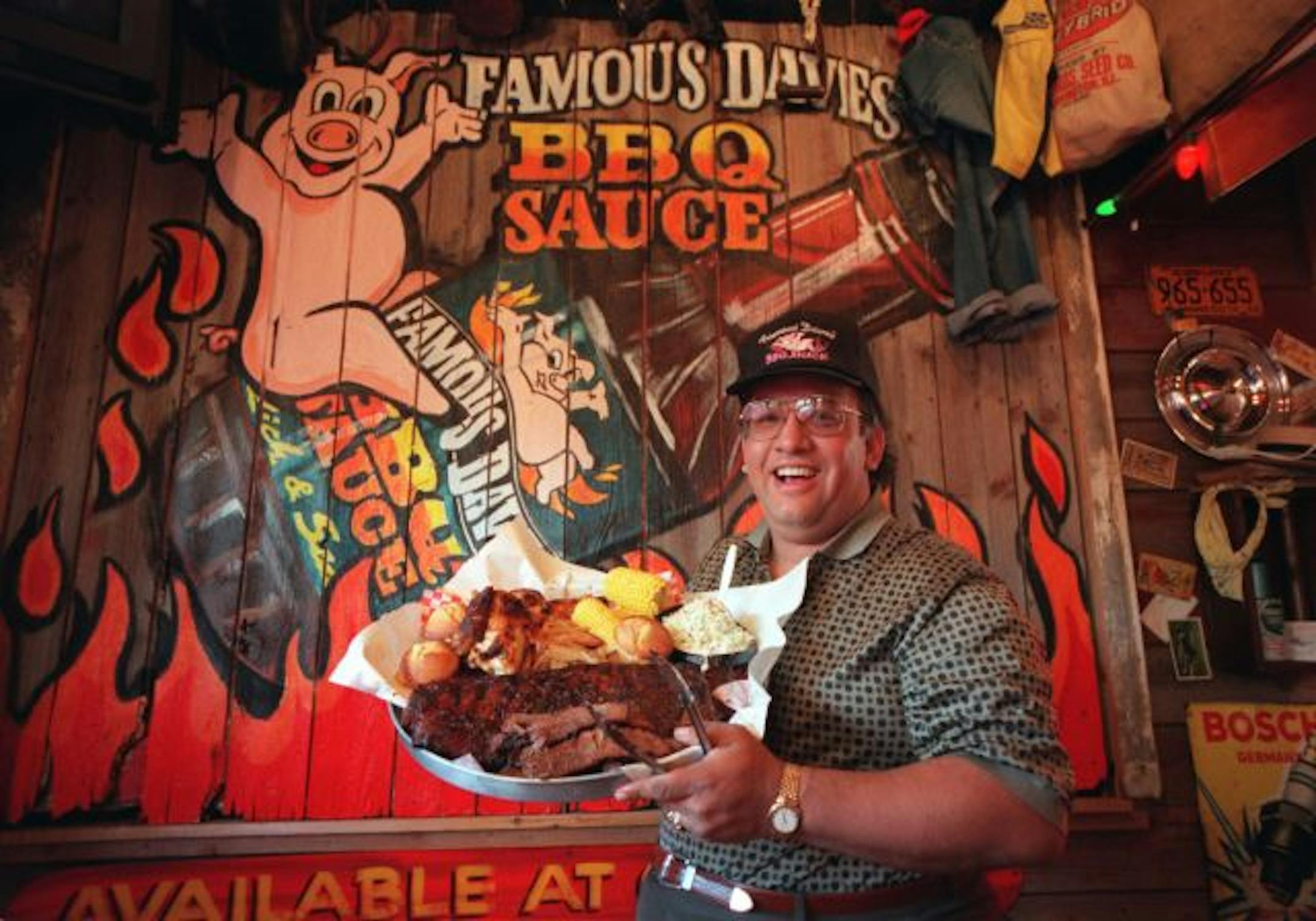 "Famous" Dave Anderson with his All-American BBQ Feast