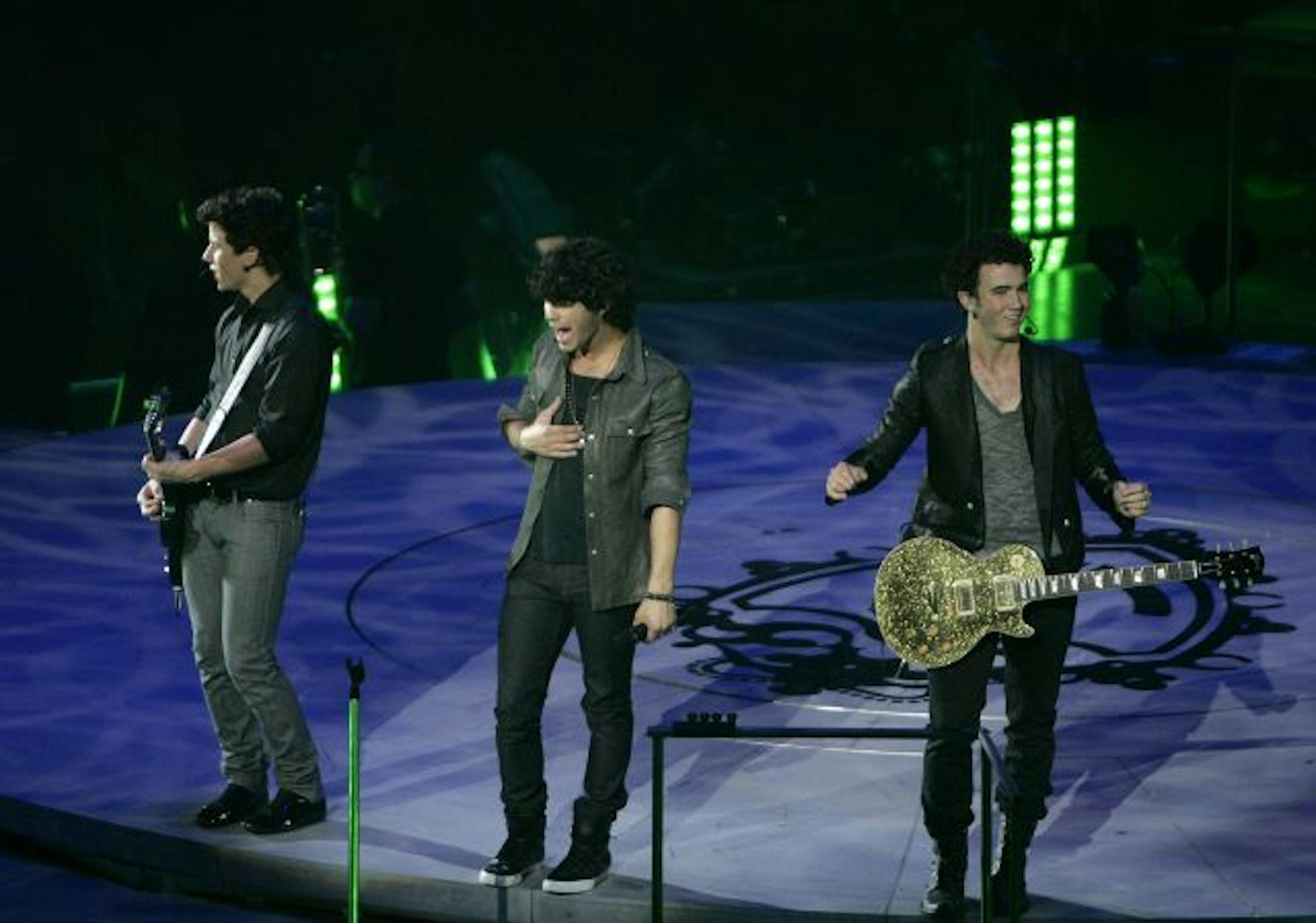The Jonas Brothers, Nick, left to right, Joe and Kevin, in concert at the Target Center.