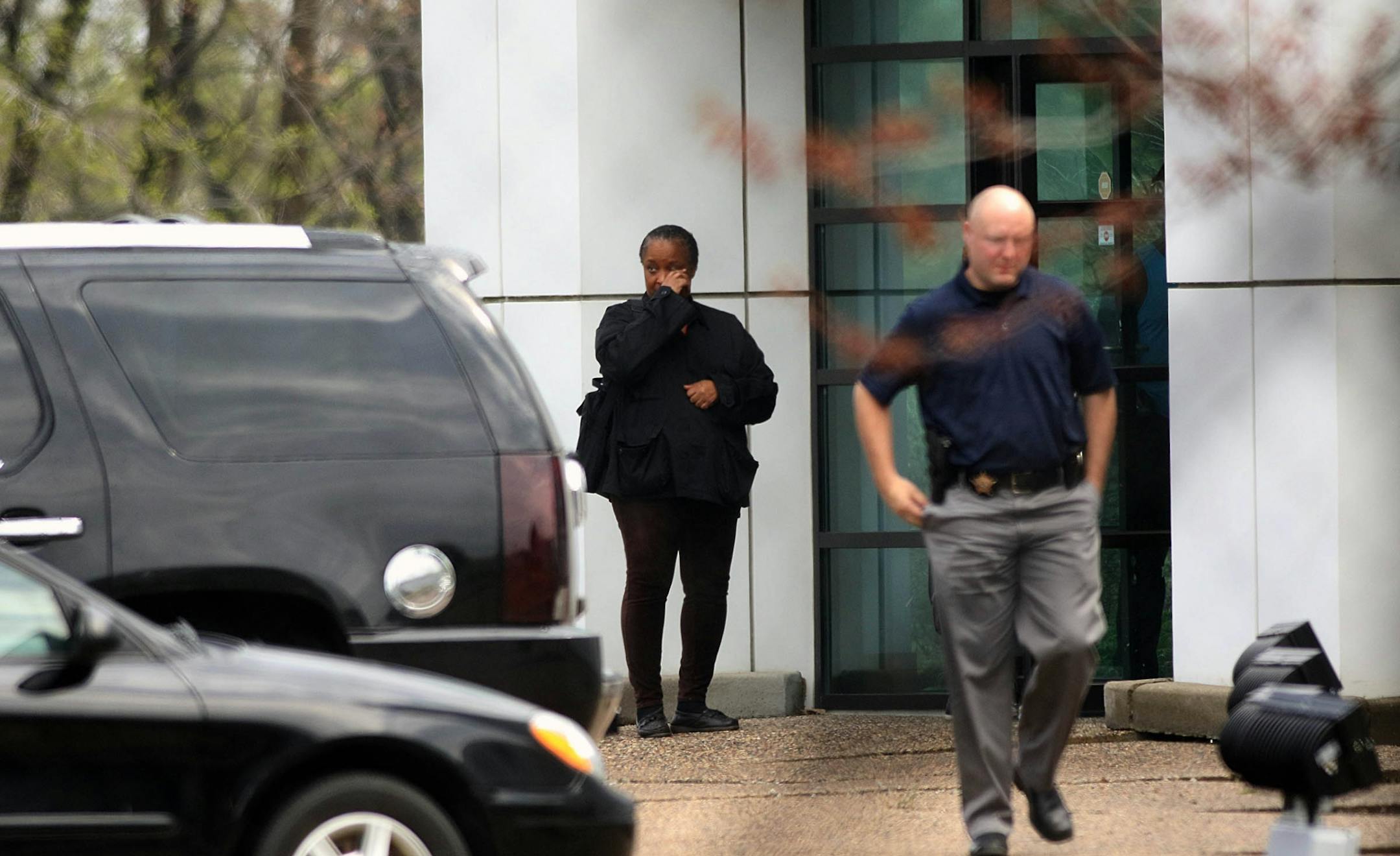 A woman wept at an entryway to Paisley Park.