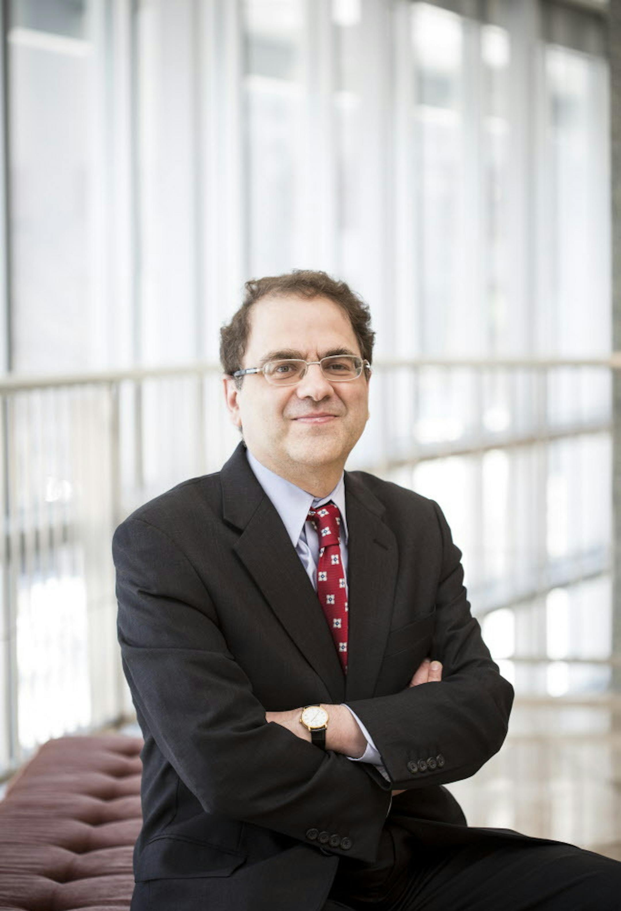 **EMBARGO: No electronic distribution, Web posting or street sales before Monday 12:01 a.m. ET Oct. 20, 2014. No exceptions for any reasons. EMBARGO set by source.** FILE -- Narayana Kocherlakota, president of the Federal Reserve Bank of Minneapolis, who has expressed caution on the timing of any interest rate increase by the Fed, at the bank&#x201a;&#xc4;&#xf4;s offices in Minneapolis, Jan. 17, 2014. The Federal Reserve still plans to wrap up its bond-buying campaign at the end of October and r