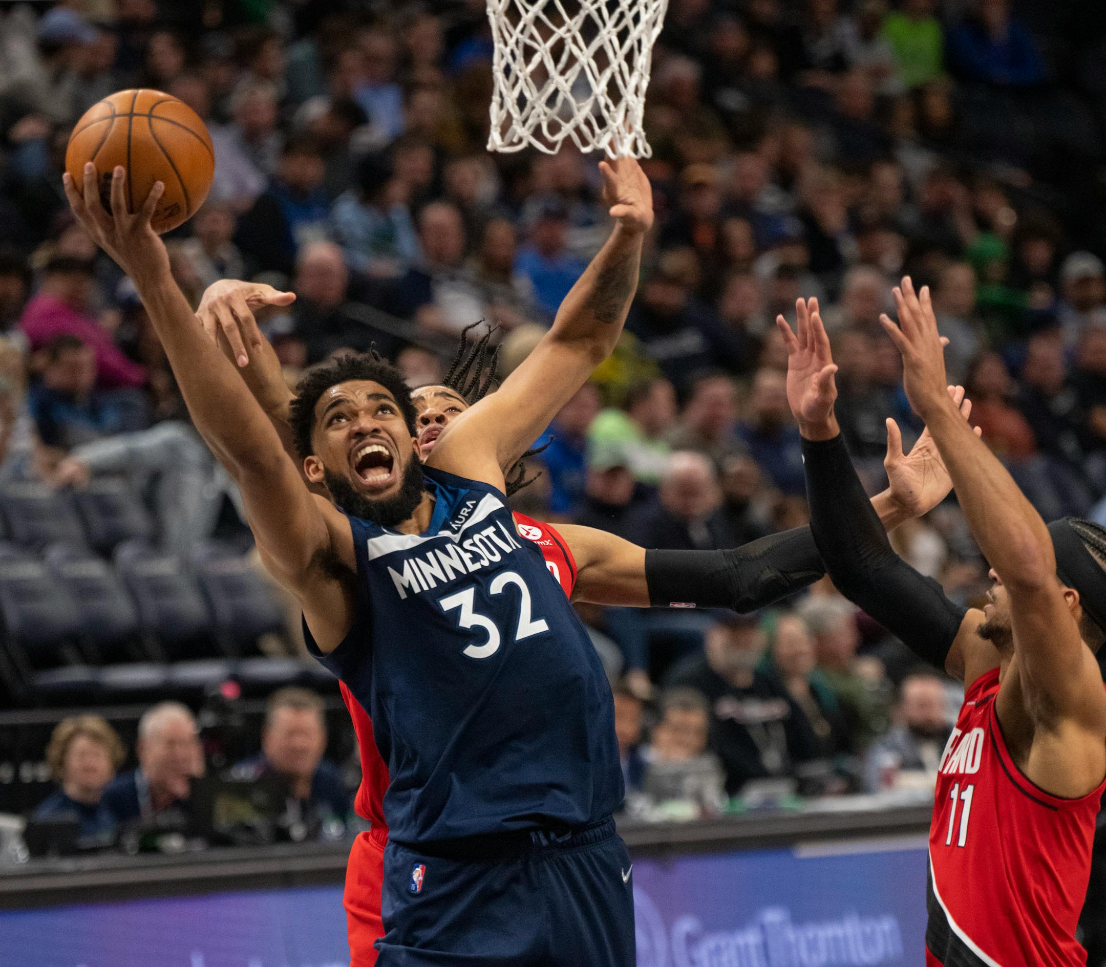 Minnesota Timberwolves center Karl-Anthony Towns (32) put up a third quarter shot for two of his 27 points in an NBA basketball game Monday night, March 7, 2022 at Target Center in Minneapolis, Minn. The Minnesota Timberwolves defeated the Portland Trail Blazers 124-81. ] JEFF WHEELER • Jeff.Wheeler@startribune.com