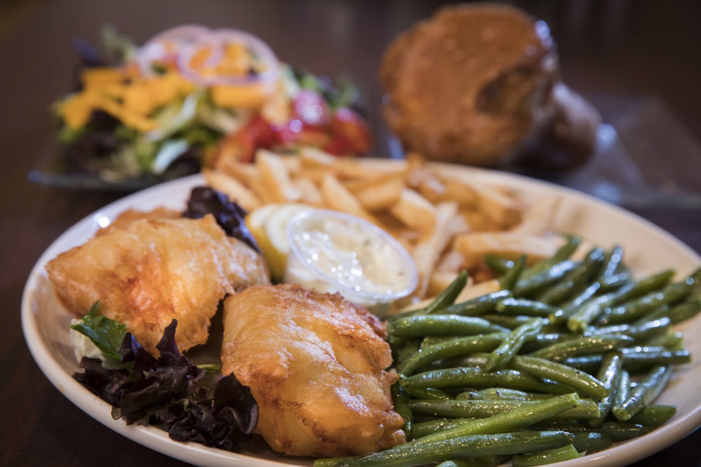 The Little Oven&#x2019;s fish-fry dinner with green beans, French fries, salad and a popover.