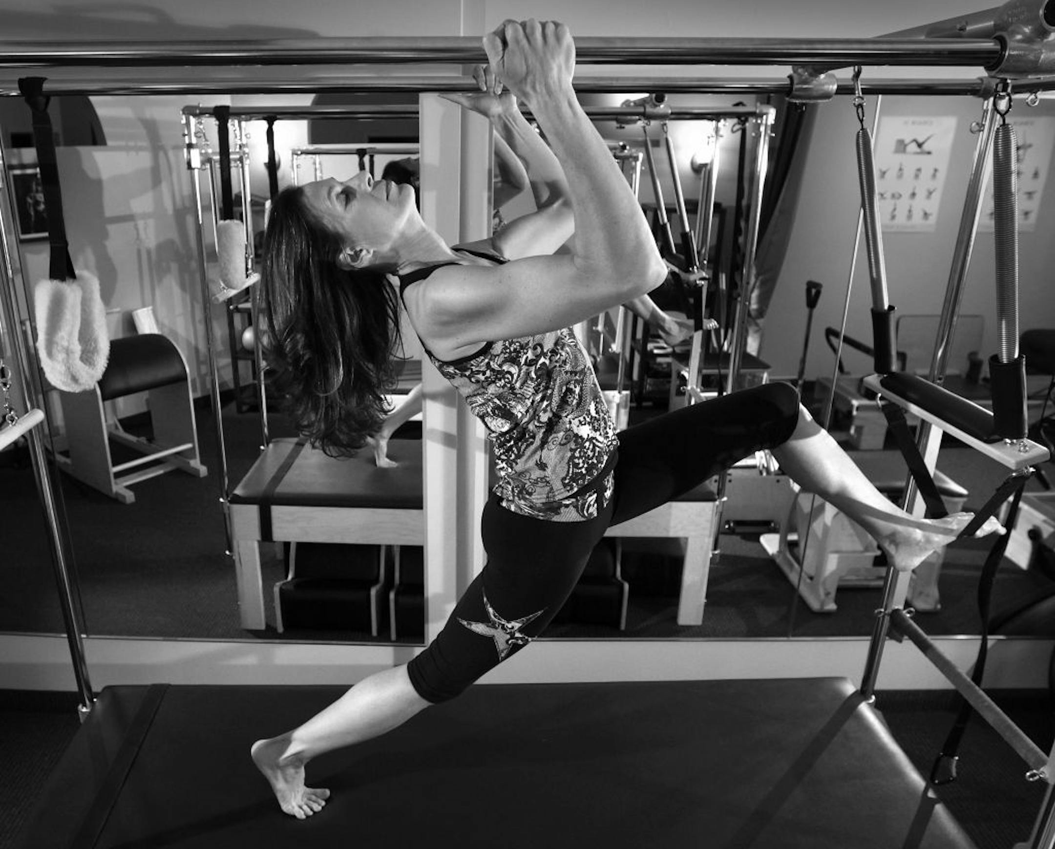 Instructor and co-owner of the Pilates Studio in Wayzata, MN. Pamela Hassebring works out on one of her pilates station.