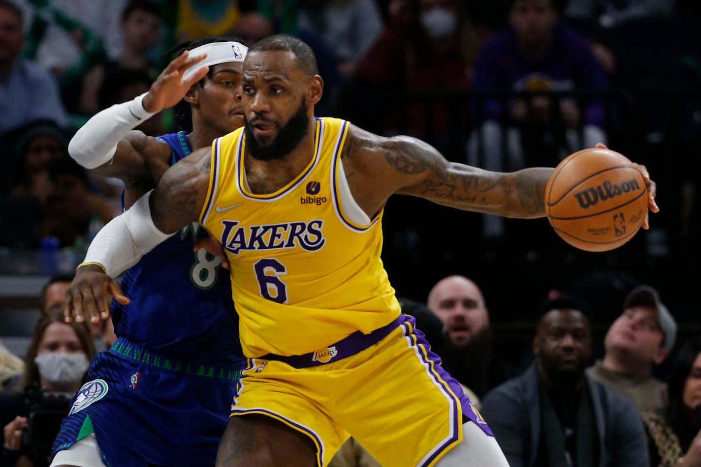 Lakers forward LeBron James works to the basket around Timberwolves forward Jarred Vanderbilt on Friday