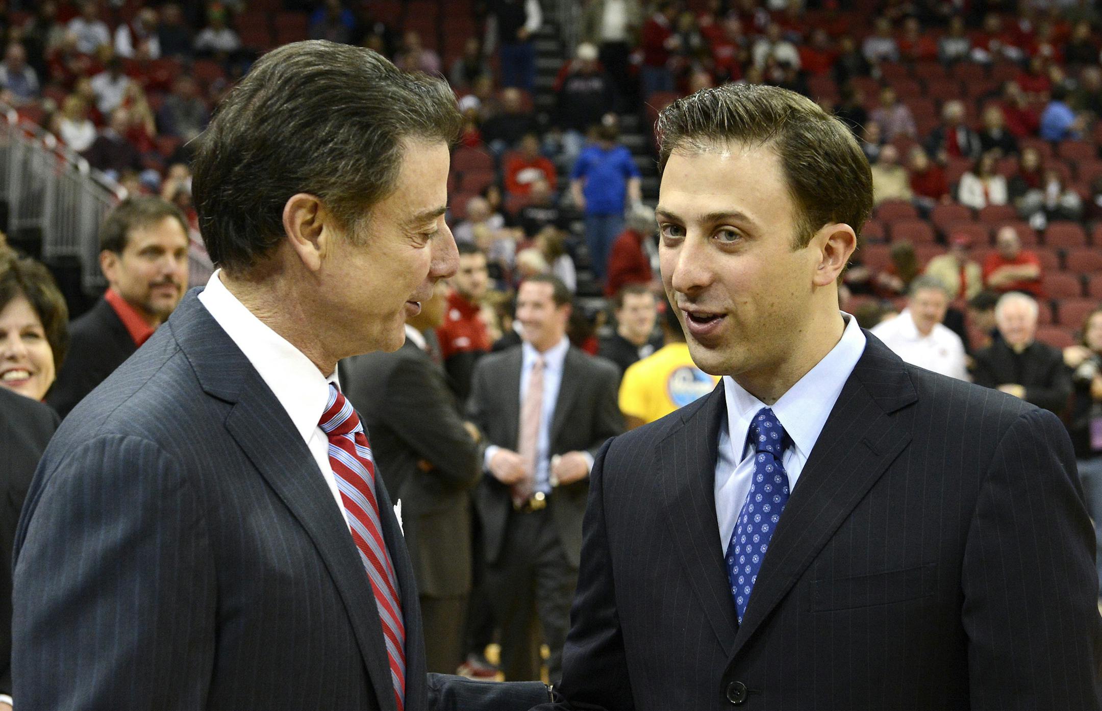 New Gophers coach Richard Pitino, right, learned much from his famous father, Louisville coach Rick Pitino, left.