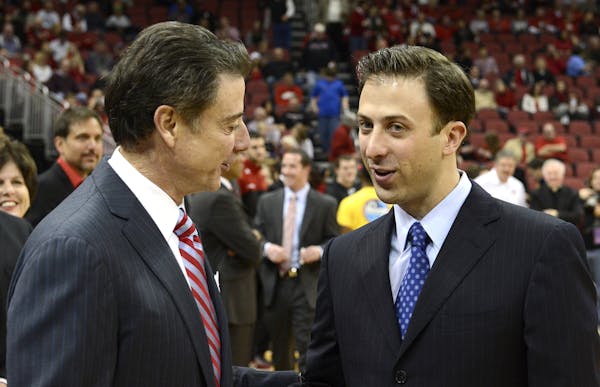 New Gophers coach Richard Pitino, right, learned much from his famous father, Louisville coach Rick Pitino, left.