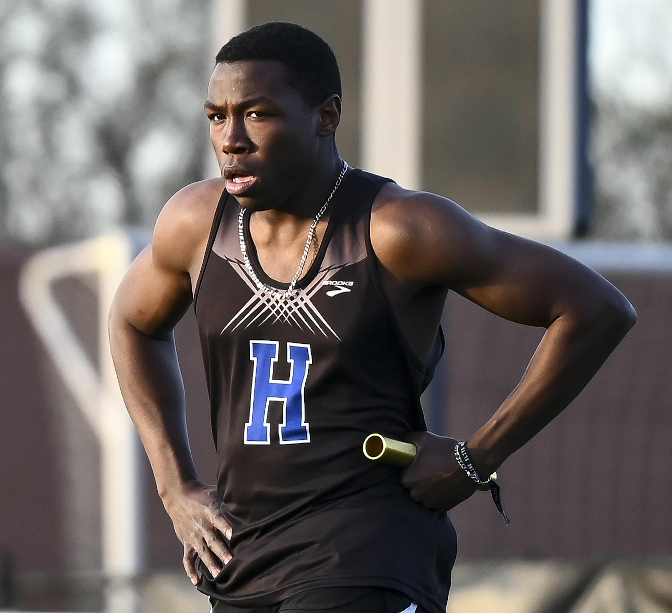 Hopkins' Joe Fahnbulleh caught his breath after anchoring the boys' 4x100 relay