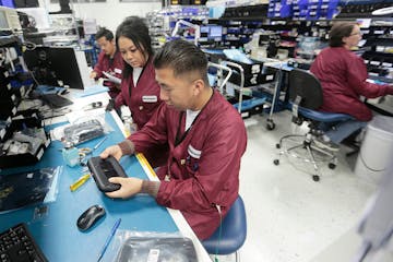 Workers at the Minnetronix Medical manufacturing facility in St. Paul. Minnetronix, a St. Paul-based company that manufactures medical devices under c