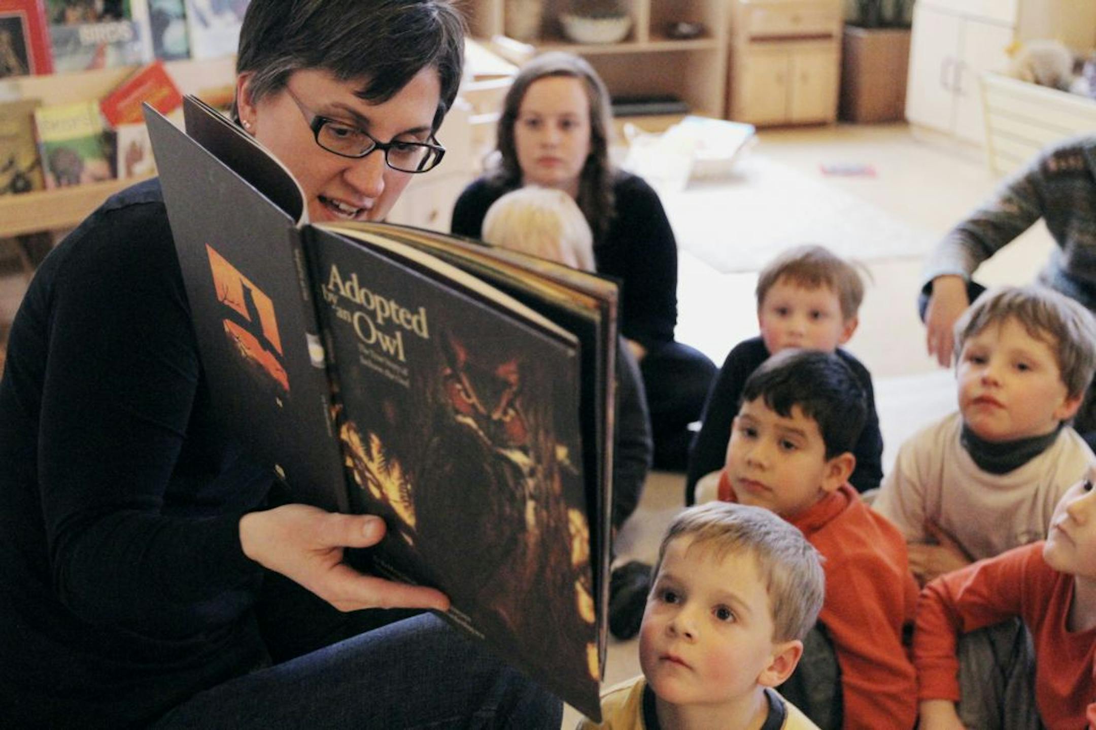 Marlais Brand's pre-school class read a book about owls on Wednesday February 15, 2012 at the Dodge Nature Center.