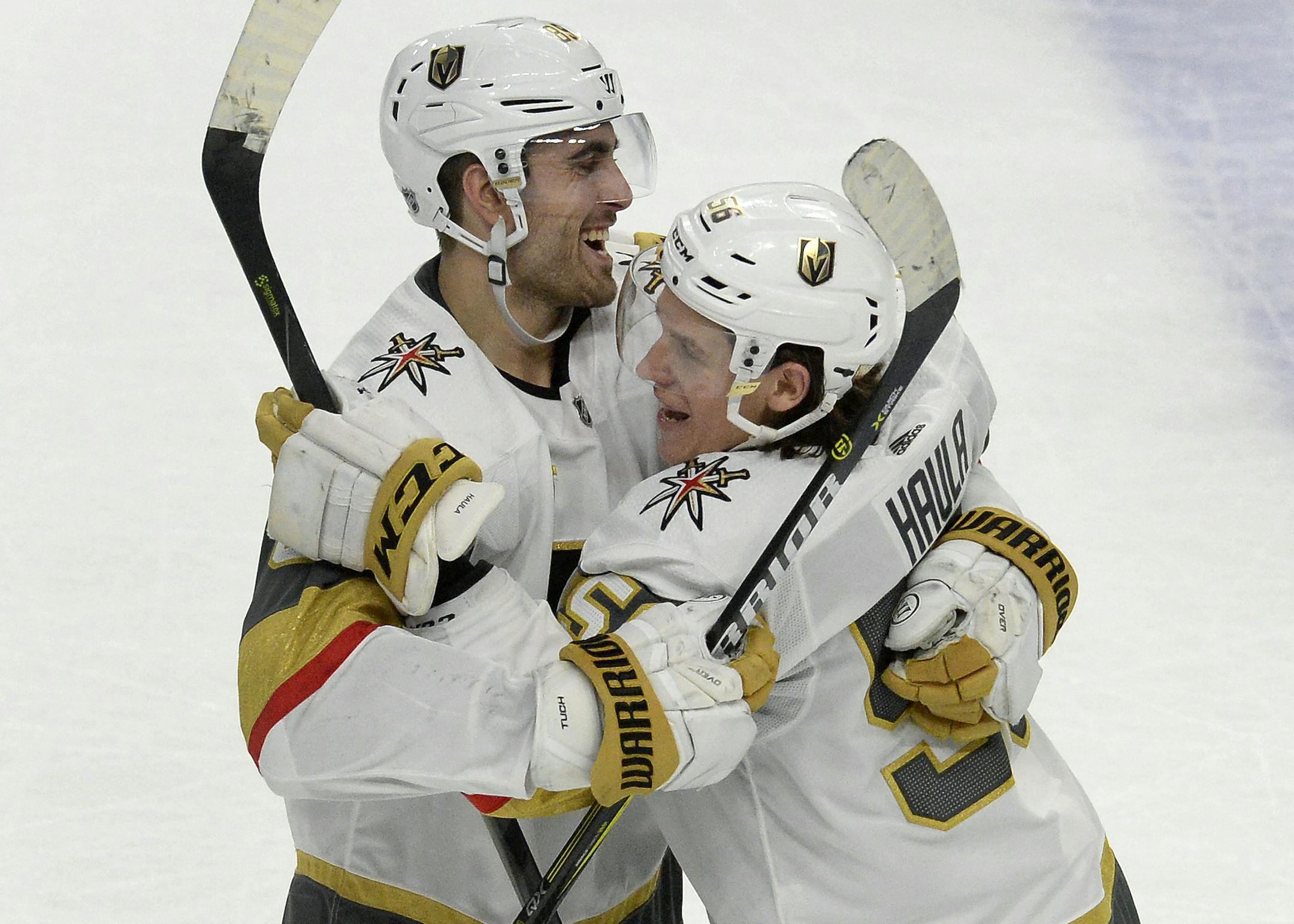 Vegas Golden Knights left wing Erik Haula, right, celebrates with right wing Alex Tuch (89) after his game-winning goal in the shootout of an NHL hockey game against the Buffalo Sabres, Saturday, March 10, 2018 in Buffalo, N.Y. Vegas beat Buffalo 2-1 in a shootout. (AP Photo/Adrian Kraus) ORG XMIT: NYAK116