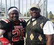 Deveall McClendon, left, with his father, Derek McClendon, while wearing his football uniform in college. Deveall was killed over a year ago in a driv