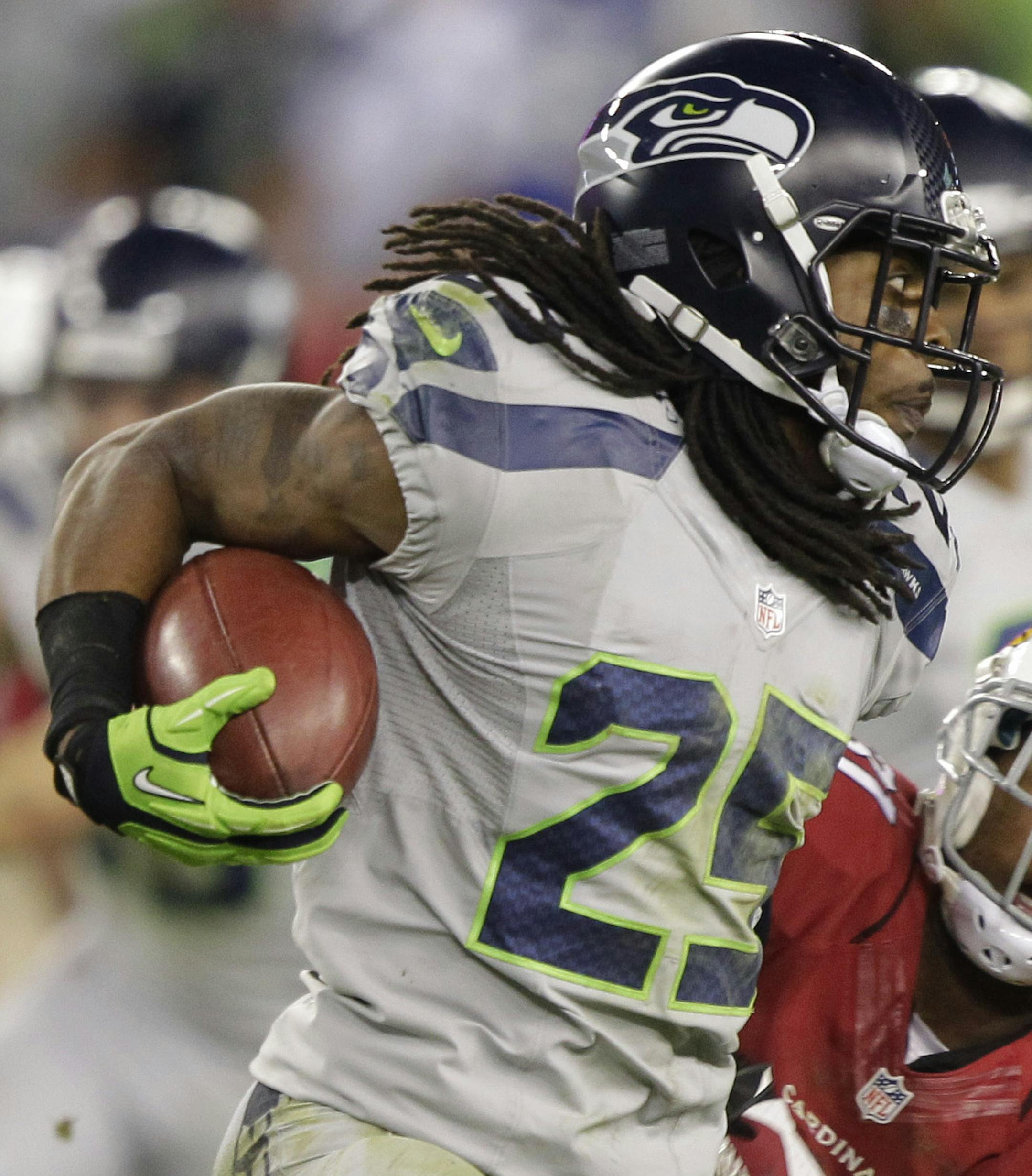 Seattle Seahawks cornerback Richard Sherman (25) runs as Arizona Cardinals' Justin Bethel (31) defends during the second half of an NFL football game, Thursday, Oct. 17, 2013, in Glendale, Ariz. (AP Photo/Rick Scuteri) ORG XMIT: MIN2013111518084080