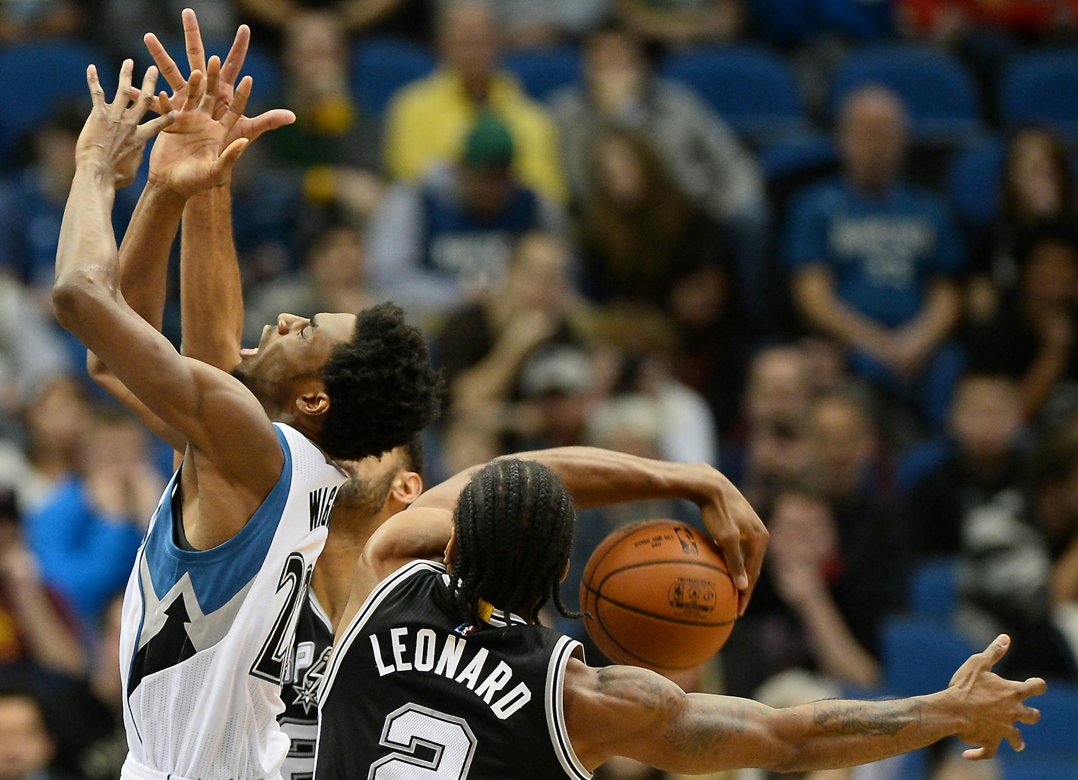 Minnesota Timberwolves guard Andrew Wiggins (22) was blocked by San Antonio Spurs forward Kawhi Leonard (2) in the first quarter. ] (AARON LAVINSKY/STAR TRIBUNE) aaron.lavinsky@startribune.com The Minnesota Timberwolves played the San Antonio Spurs on Wednesday, Dec. 23, 2015 at Target Center in Minneapolis, Minn.