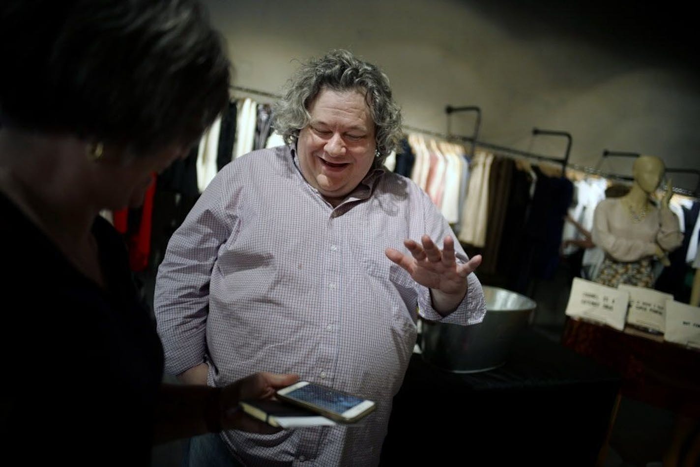 Patric Richardson, aka the Laundry Evangelist, show Becky Lang how to take care of her husband's army uniform. has begun teaching laundry camp, where he explains how textiles and chemical reactions meet during the process of doing laundry.