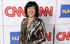 FILE - In this Jan. 10, 2014, file photo, Christiane Amanpour of CNN reacts to photographers at the CNN Worldwide All-Star Party in Pasadena, Calif. A
