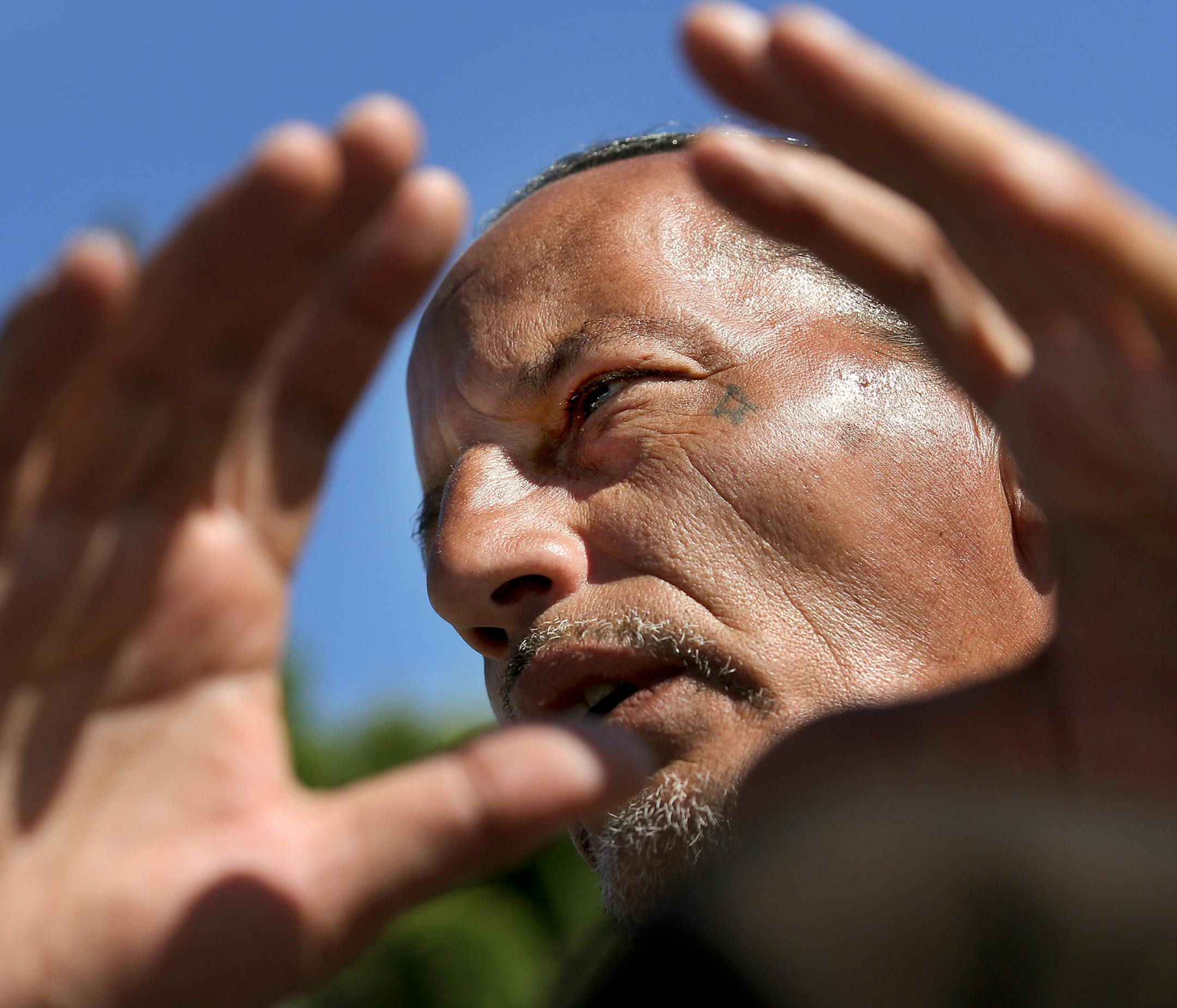 James Cross, the founder of the street outreach group Natives Against Heroin, spent nearly half of his life in prison for drug-related crimes. Here, Cross talks about how NAH is patrolling and working to help residents of a growing homeless encampment and seen Wednesday, Sept. 5, 2018, in south Minneapolis, MN. A tattoo from his days as a gang member and convicted felon is visible near his eye.] DAVID JOLES ï david.joles@startribune.com James Cross, the founder of the street outreach group Nativ