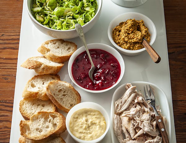 From top left, clockwise, Brussels Sprout Slaw; vegetable dip; cranberry vinaigrette; turkey; aioli.