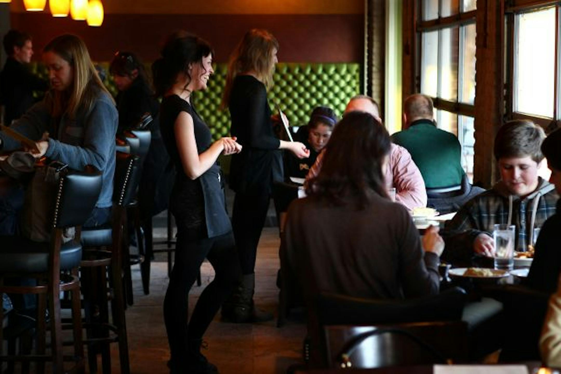 Rachel Lyles talked with a customer during dinner service at Jack's (Formerly Java Jack's) in Minneapolis.