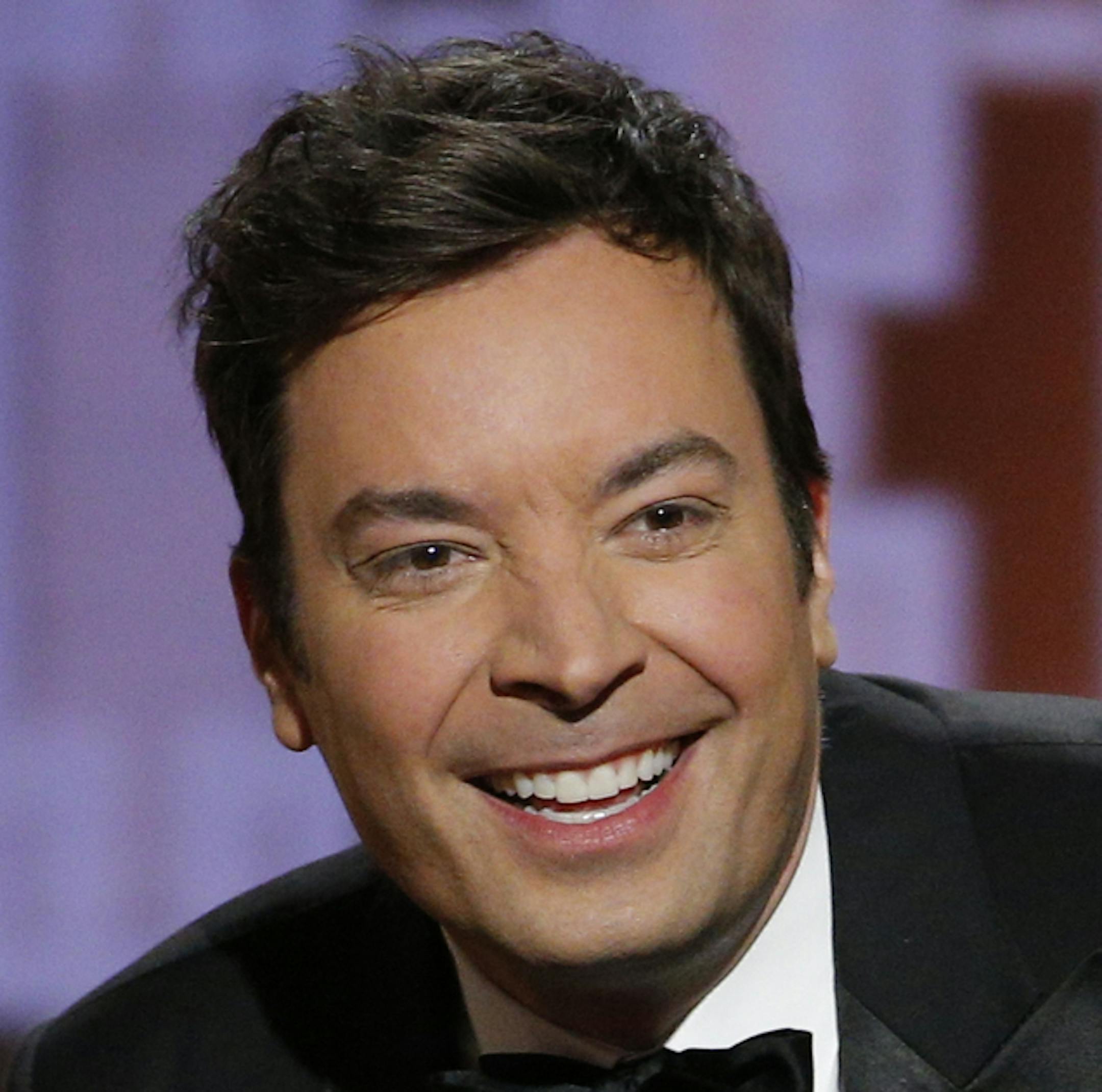 This image released by NBC shows host Jimmy Fallon at the 74th Annual Golden Globe Awards held at the Beverly Hilton Hotel on Sunday, Jan. 8, 2017. (Paul Drinkwater/NBC via AP)