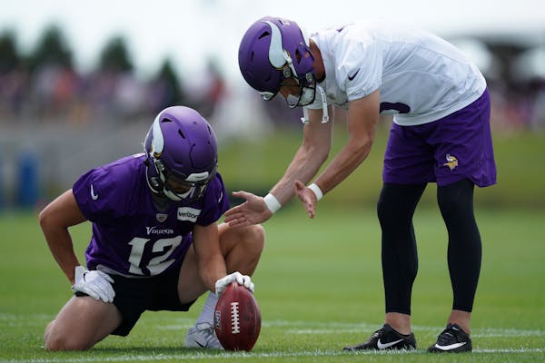 Minnesota Vikings wide receiver Chad Beebe (12) and kicker Dan Bailey (5) worked together on ball placement during training camp Friday.