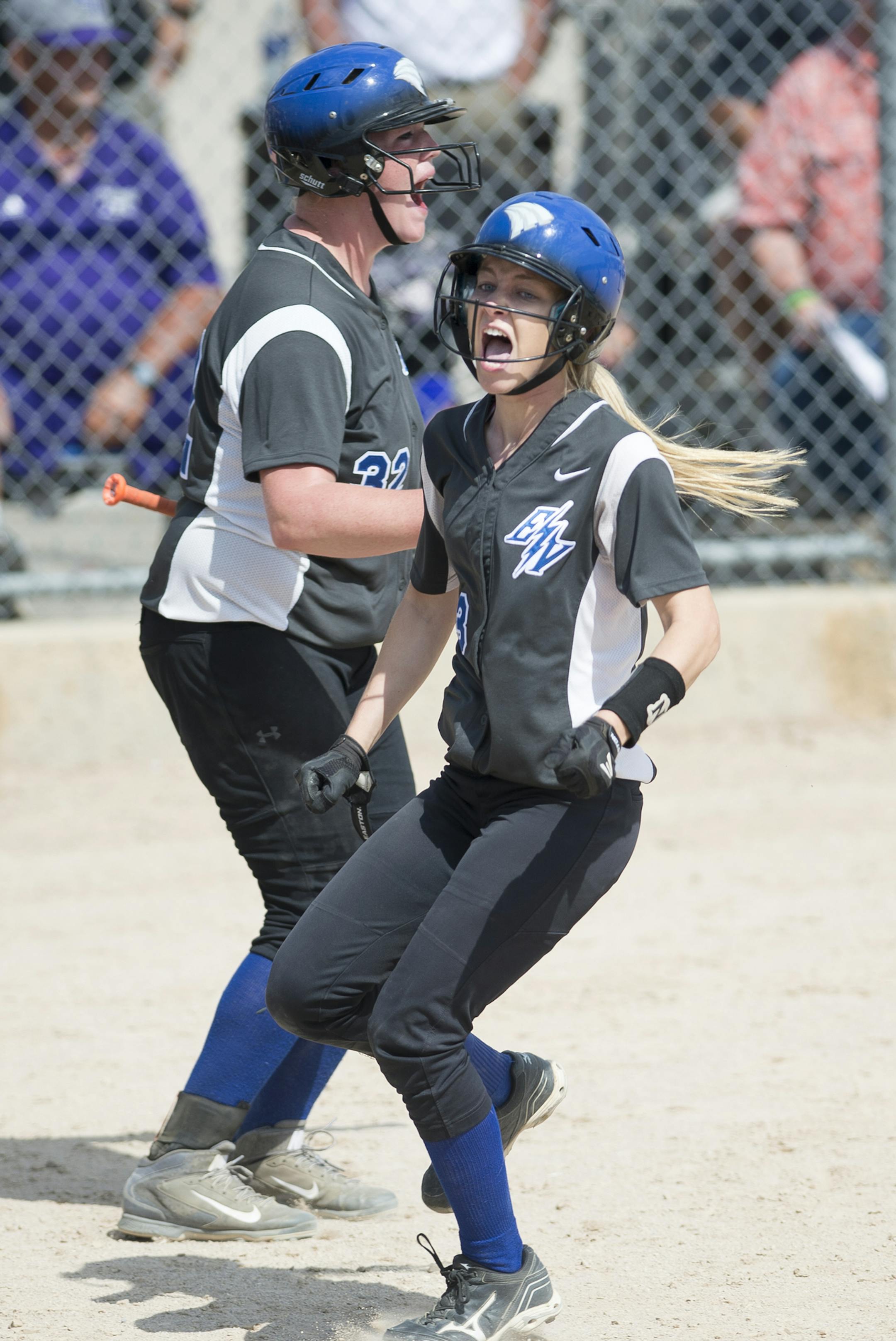 Eastview outfielder Courtney Wissbaum (3) and pitcher Kerrigan Hoshaw (32) celebrated after Wissbaum scored the game-winning run against Anoka in a 3A championship game Friday. ] Aaron Lavinsky • aaron.lavinsky@startribune.com The softball state tournament finals were held Friday, June 5, 2015 at Caswell Park in Mankato.
