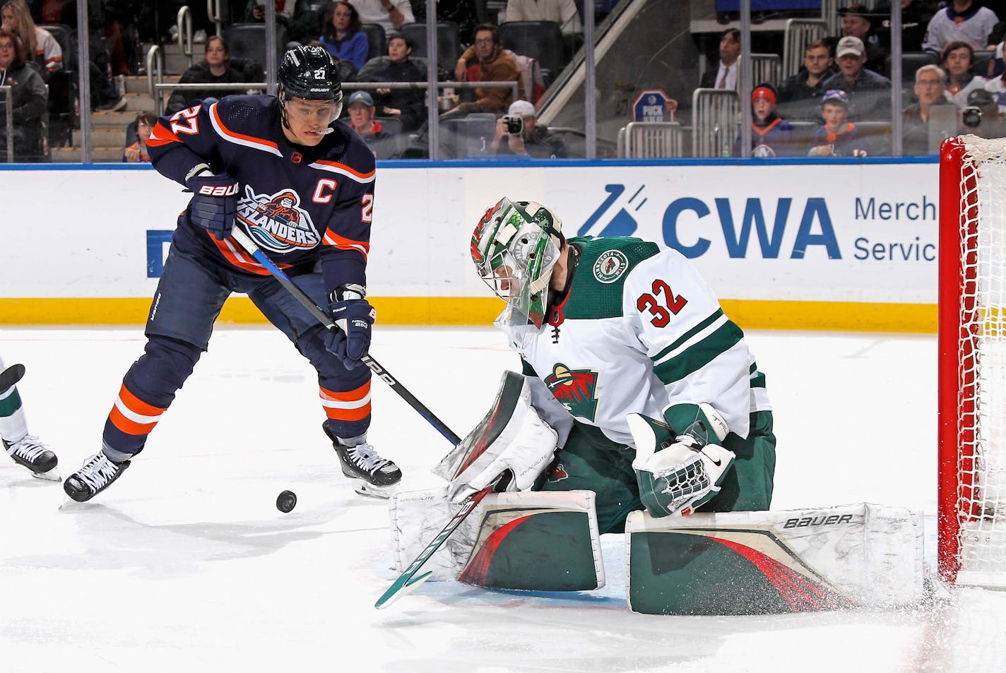 The Wild's Filip Gustavsson stopped a shot from the Islanders' Anders Lee when the teams met Jan. 12 in Elmont, N.Y.