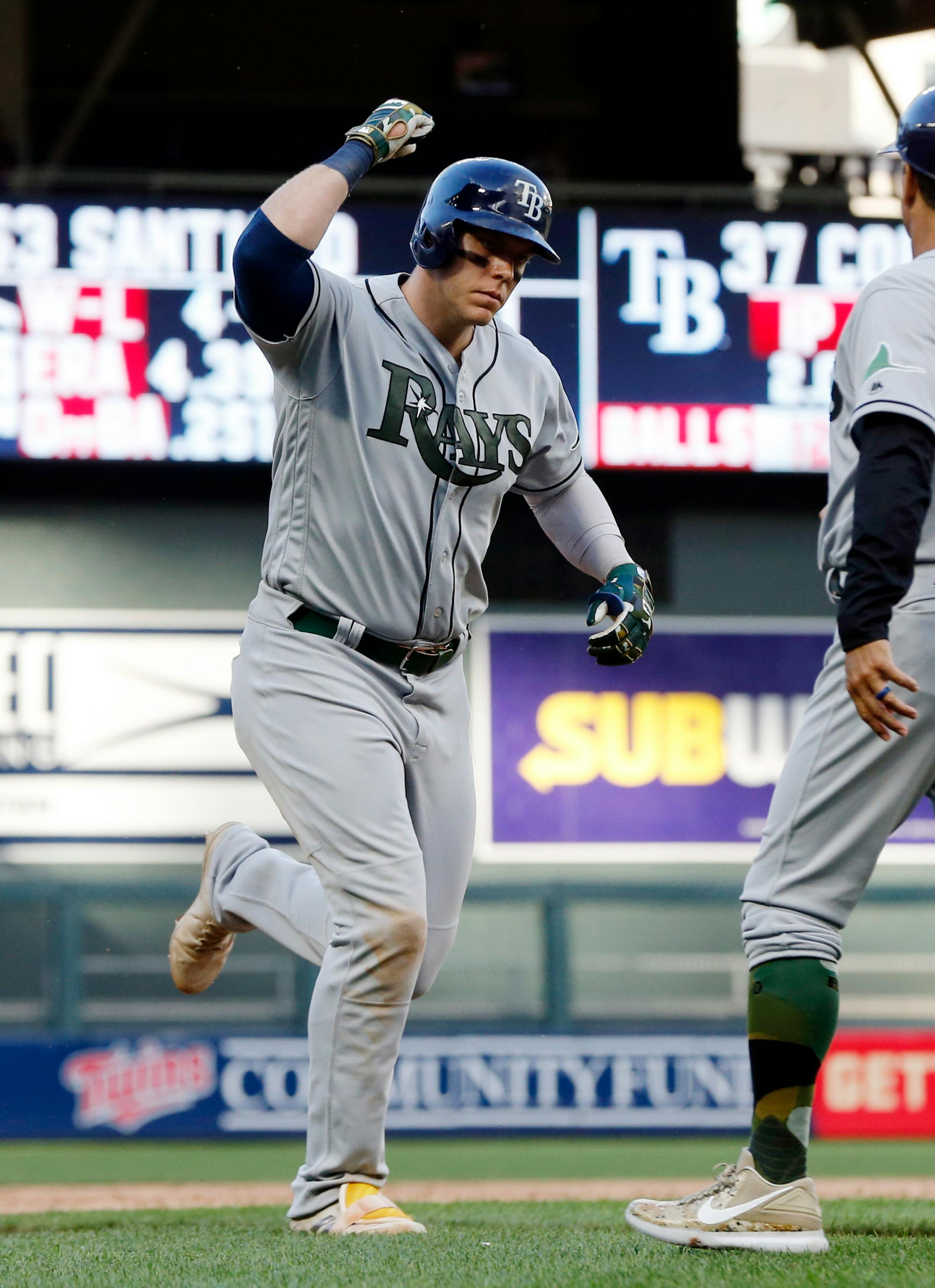 Tampa Bay Rays' Logan Morrison celebrates as he rounds third on a solo home run off Minnesota Twins pitcher Hector Santiago in the 15th inning of a baseball game Sunday, May 28, 2017 in Minneapolis. (AP Photo/Jim Mone)