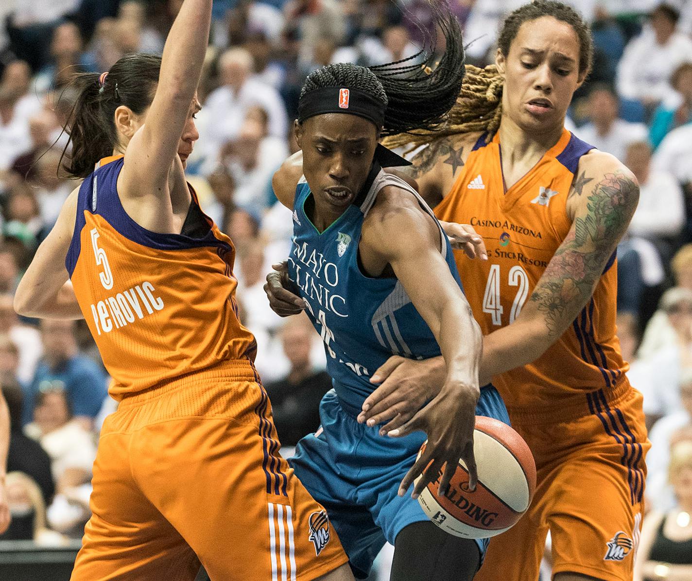 Phoenix Mercury center Brittney Griner (42) knocked the ball away from Minnesota Lynx center Sylvia Fowles (34) as Phoenix Mercury forward Sonja Petrovic (5) defends.