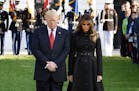 U.S. President Donald Trump and first lady Melania Trump, joined by White House staff, participate in a moment of silence on the 16th anniversary of t