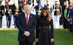 U.S. President Donald Trump and first lady Melania Trump, joined by White House staff, participate in a moment of silence on the 16th anniversary of t