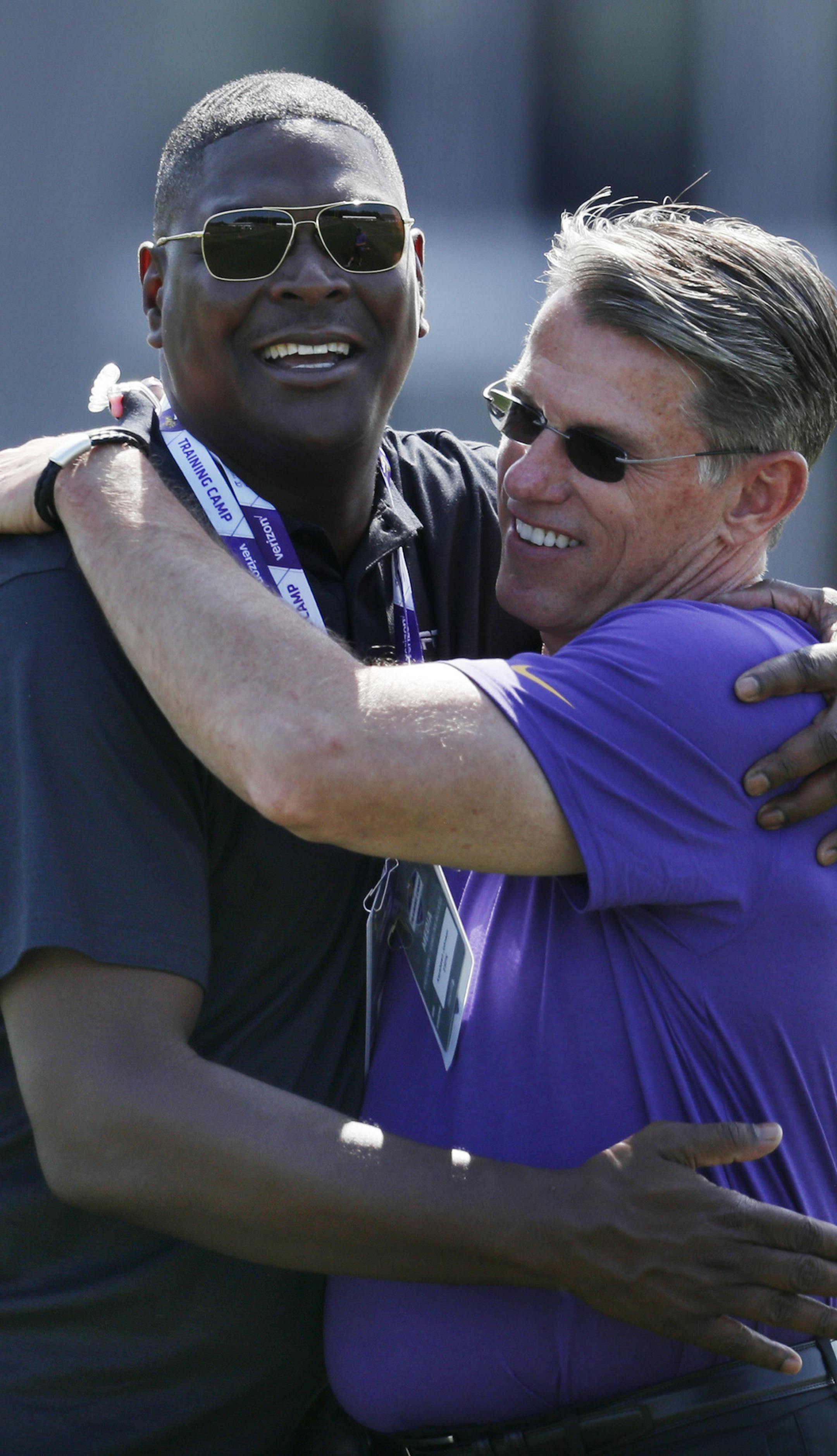 Former NFL receiver Keyshawn Johnson left, hugged Vikings GM Rick Spielman during Minnesota Vikings training camp at TCO Performance center Saturday July 28, 2018 in Eagan, MN. ] JERRY HOLT ï jerry.holt@startribune.com
